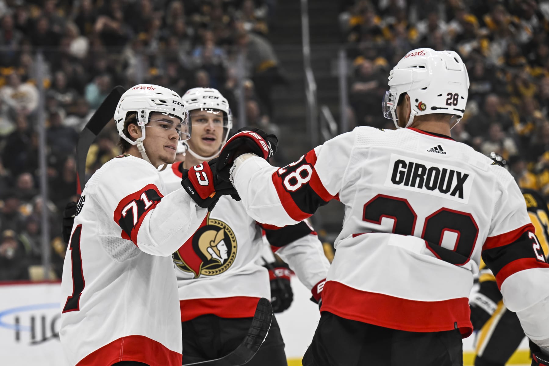 PITTSBURGH, PA - OCTOBER 28: Ottawa Senators center Ridly Greig (71) celebrates his goal with Ottawa Senators right wing Claude Giroux (28) during the first period in the NHL game between the Pittsburgh Penguins and the Ottawa Senators on October 28, 2023, at PPG Paints Arena in Pittsburgh, PA. (Photo by Jeanine Leech/Icon Sportswire via Getty Images)