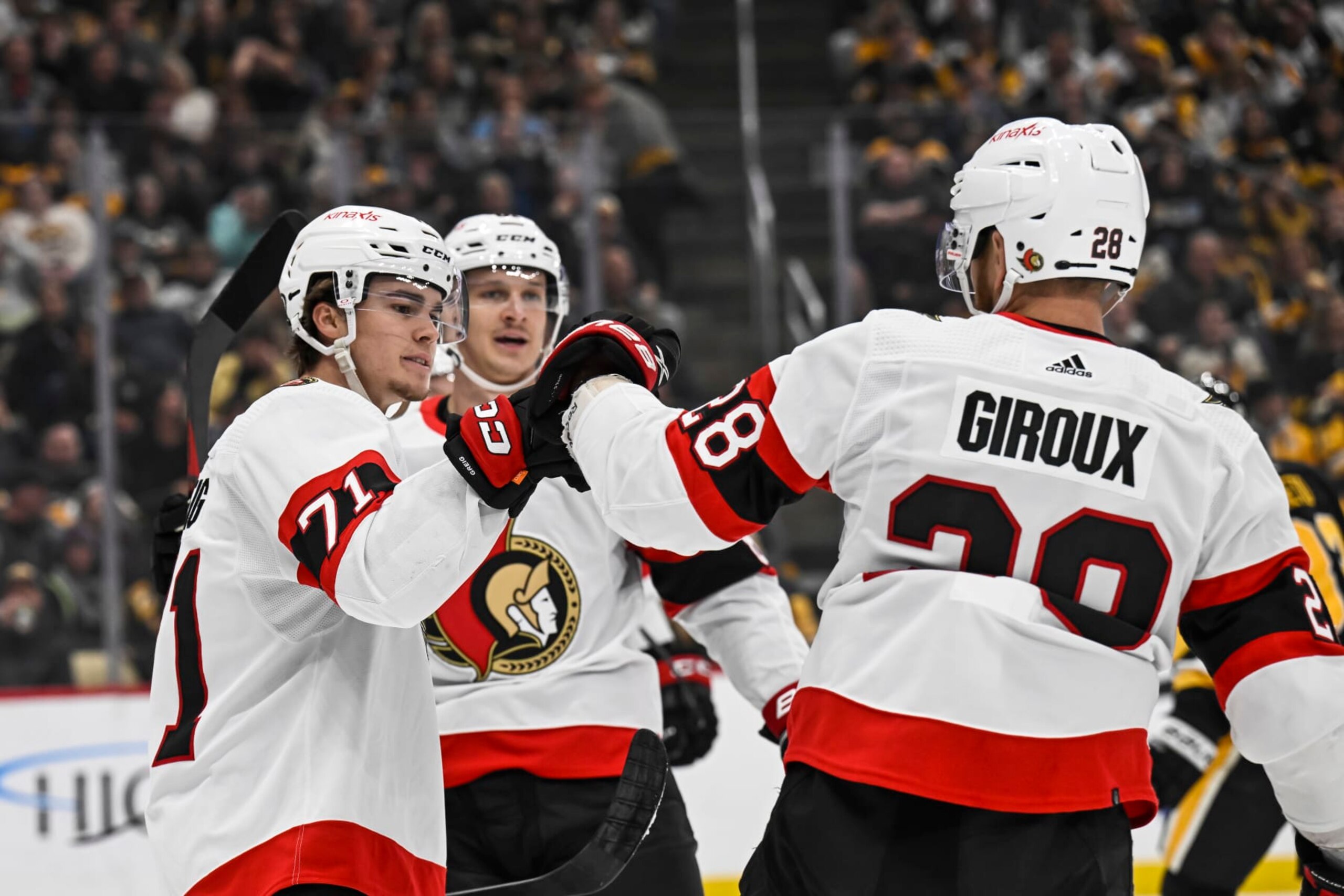 PITTSBURGH, PA - OCTOBER 28: Ottawa Senators center Ridly Greig (71) celebrates his goal with Ottawa Senators right wing Claude Giroux (28) during the first period in the NHL game between the Pittsburgh Penguins and the Ottawa Senators on October 28, 2023, at PPG Paints Arena in Pittsburgh, PA. (Photo by Jeanine Leech/Icon Sportswire via Getty Images)