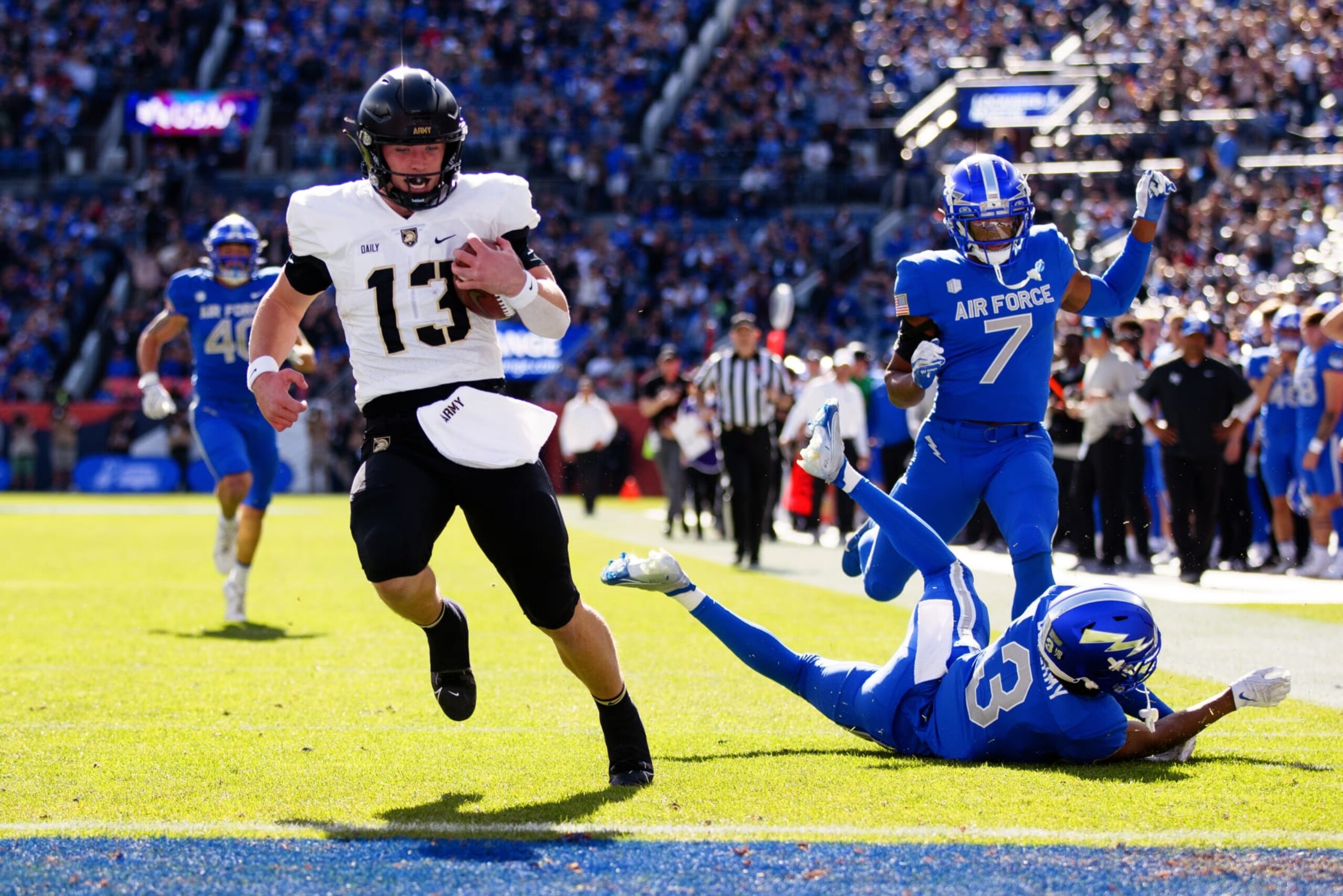 DENVER, CO - NOVEMBER 4:  Quarterback Bryson Daily #13 of the Army Black Knights scores a first quarter touchdown against the Air Force Falcons at Empower Field at Mile High on November 4, 2023 in Denver, Colorado. (Photo by Justin Edmonds/Getty Images)