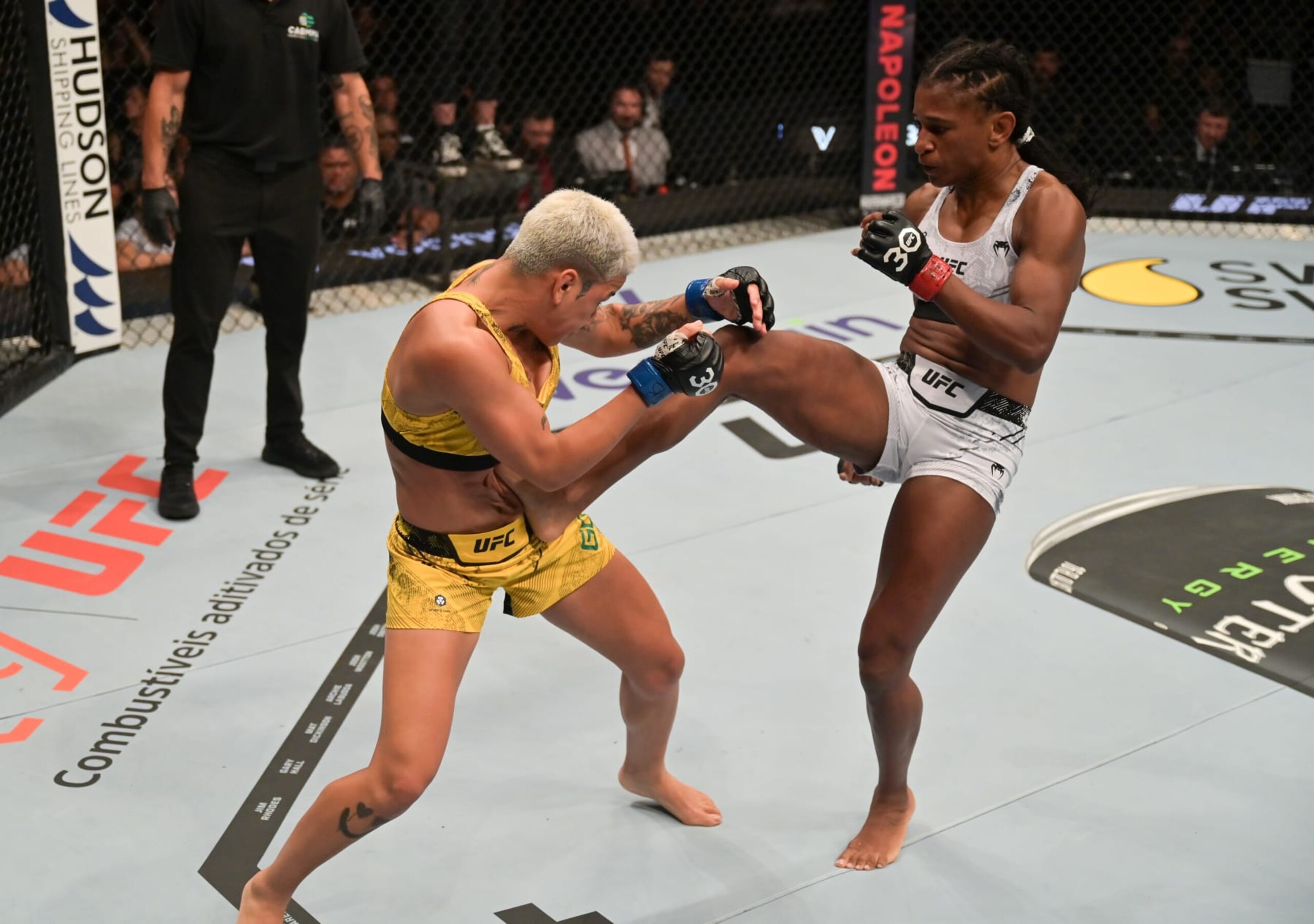 SAO PAULO, BRAZIL - NOVEMBER 04: (R-L) Angela Hill kicks Denise Gomes of Brazil in a strawweight fight during the UFC Fight Night event at Ibirapuera Gymnasium on November 04, 2023 in Sao Paulo, Brazil. (Photo by Pedro Vilela/Zuffa LLC via Getty Images)