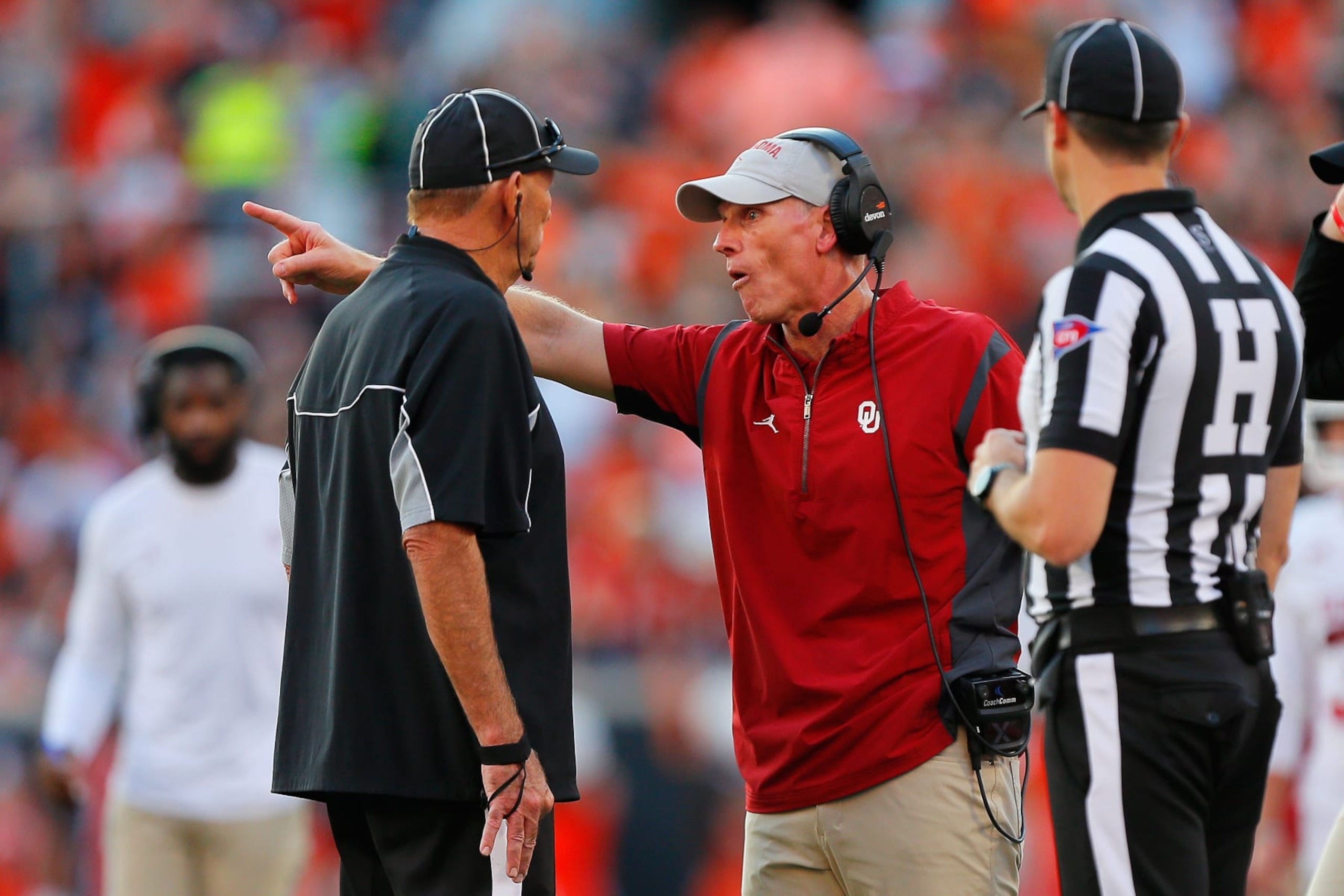STILLWATER, OK - NOVEMBER 4:  Head coach Brent Venables of the Oklahoma Sooners questions the lack of a call with an official after an incomplete pass in the end zone against the Oklahoma State Cowboys late in the fourth quarter of the Bedlam series game at Boone Pickens Stadium on November 4, 2023 in Stillwater, Oklahoma.  Oklahoma State won 27-24.  (Photo by Brian Bahr/Getty Images)