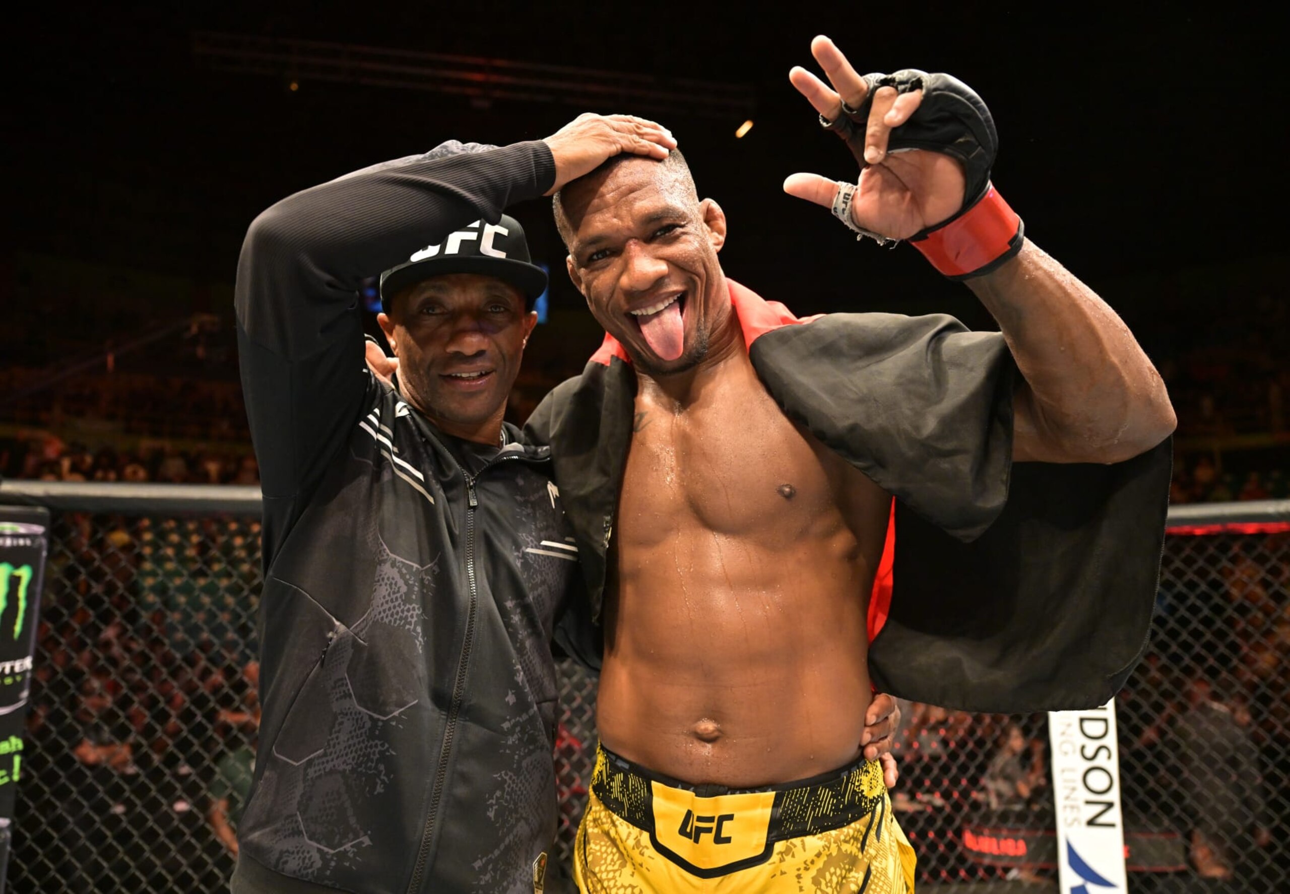 SAO PAULO, BRAZIL - NOVEMBER 04: Jailton Almeida of Brazil celebrates with his father after defeating Derrick Lewis in a heavyweight fight during the UFC Fight Night event at Ibirapuera Gymnasium on November 04, 2023 in Sao Paulo, Brazil. (Photo by Pedro Vilela/Zuffa LLC via Getty Images)