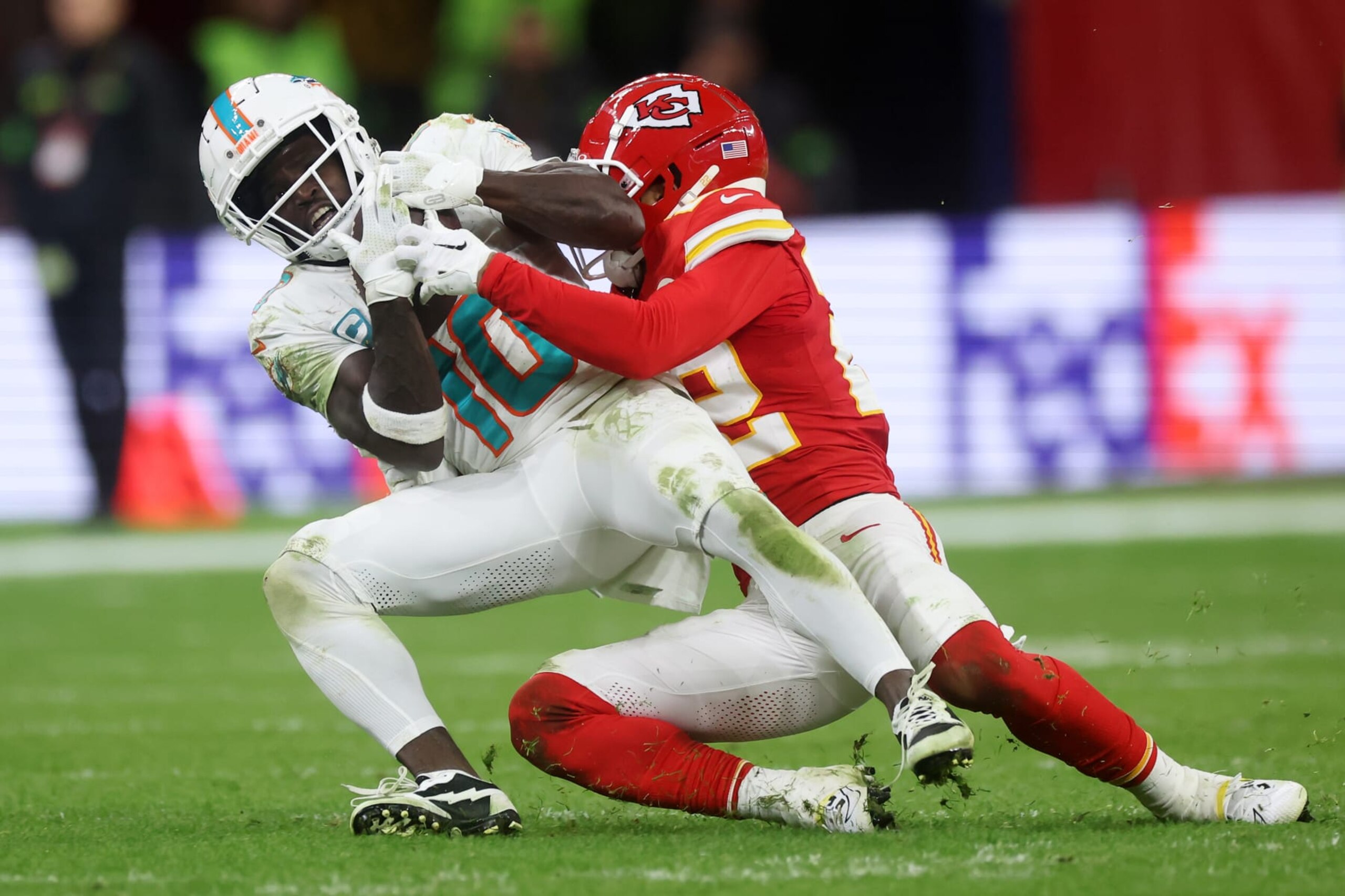 FRANKFURT AM MAIN, GERMANY - NOVEMBER 05: Tyreek Hill #10 of the Miami Dolphins is tackled by Trent McDuffie #22 of the Kansas City Chiefs in the fourth quarter during the NFL match between Miami Dolphins and Kansas City Chiefs at Deutsche Bank Park on November 05, 2023 in Frankfurt am Main, Germany. (Photo by Alex Grimm/Getty Images)
