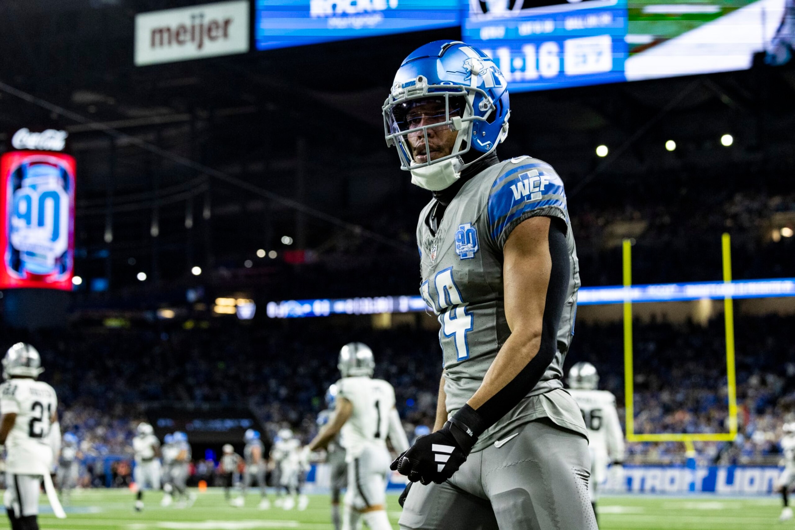 DETROIT, MICHIGAN - OCTOBER 30: Amon-Ra St. Brown #14 of the Detroit Lions looks down field after getting a first down during the game against the Las Vegas Raiders at Ford Field on October 30, 2023 in Detroit, Michigan. The Lions beat the Raiders 26-14. (Photo by Lauren Leigh Bacho/Getty Images)