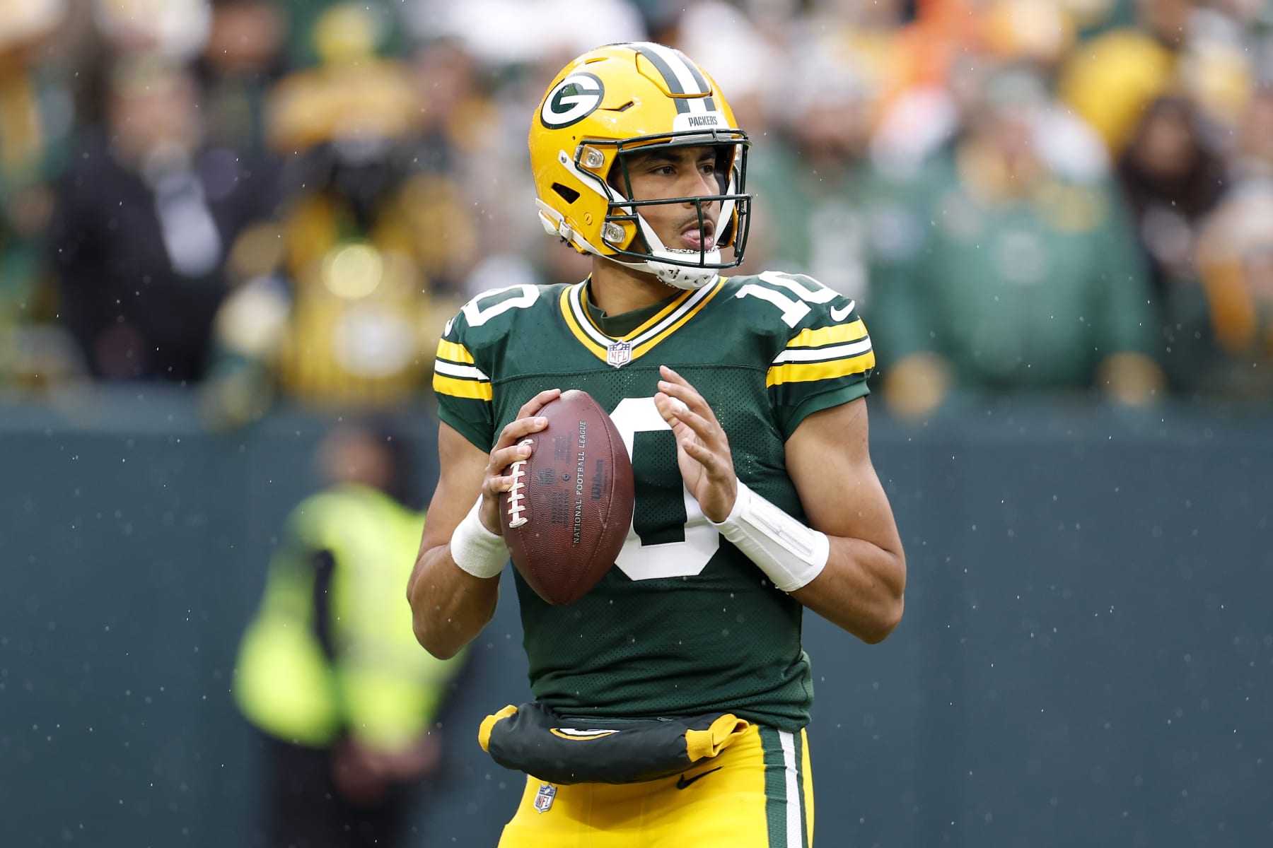 GREEN BAY, WISCONSIN - NOVEMBER 05: Jordan Love #10 of the Green Bay Packers looks to throw a pass in the first quarter of a game against the Los Angeles Rams at Lambeau Field on November 05, 2023 in Green Bay, Wisconsin. (Photo by John Fisher/Getty Images)