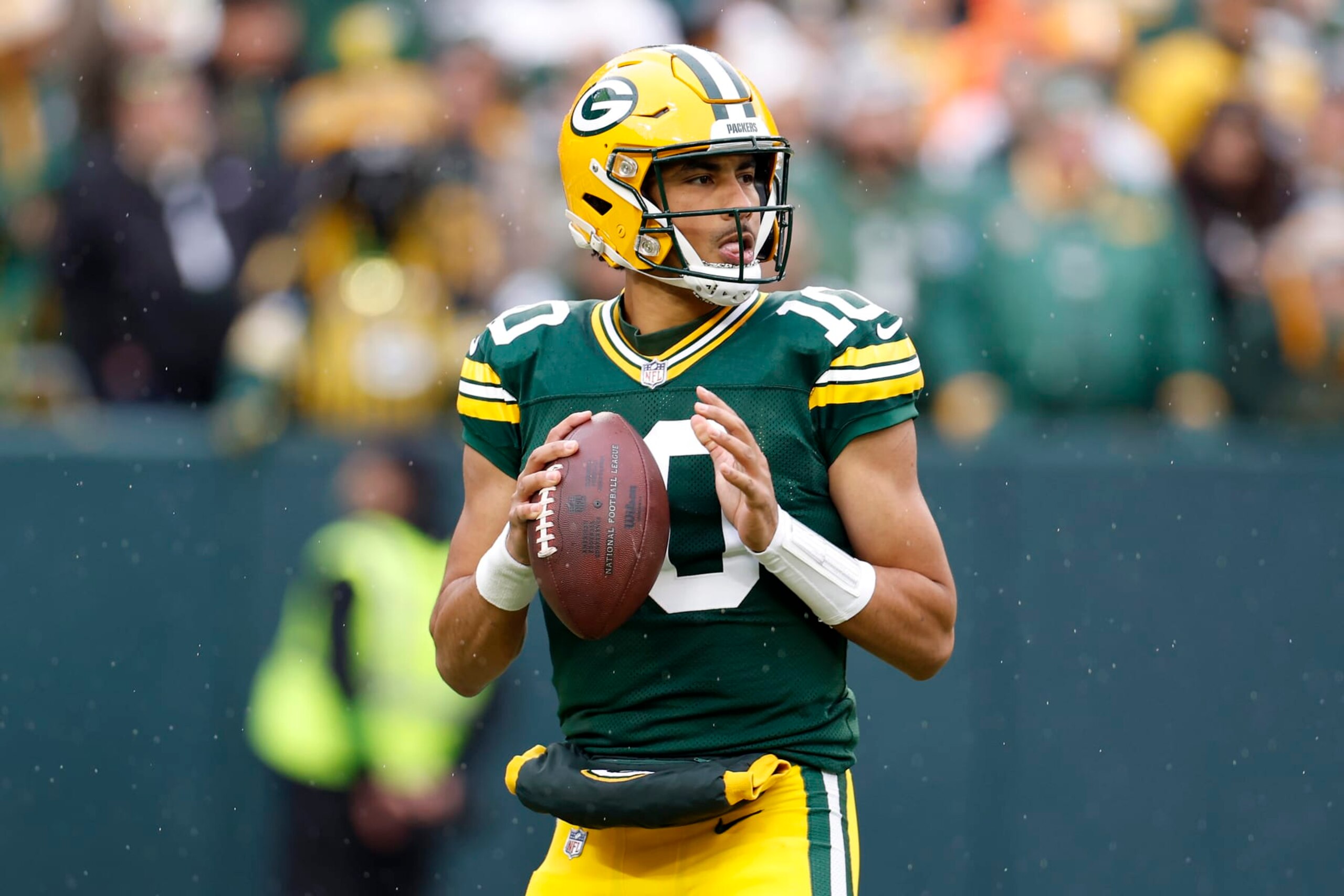 GREEN BAY, WISCONSIN - NOVEMBER 05: Jordan Love #10 of the Green Bay Packers looks to throw a pass in the first quarter of a game against the Los Angeles Rams at Lambeau Field on November 05, 2023 in Green Bay, Wisconsin. (Photo by John Fisher/Getty Images)