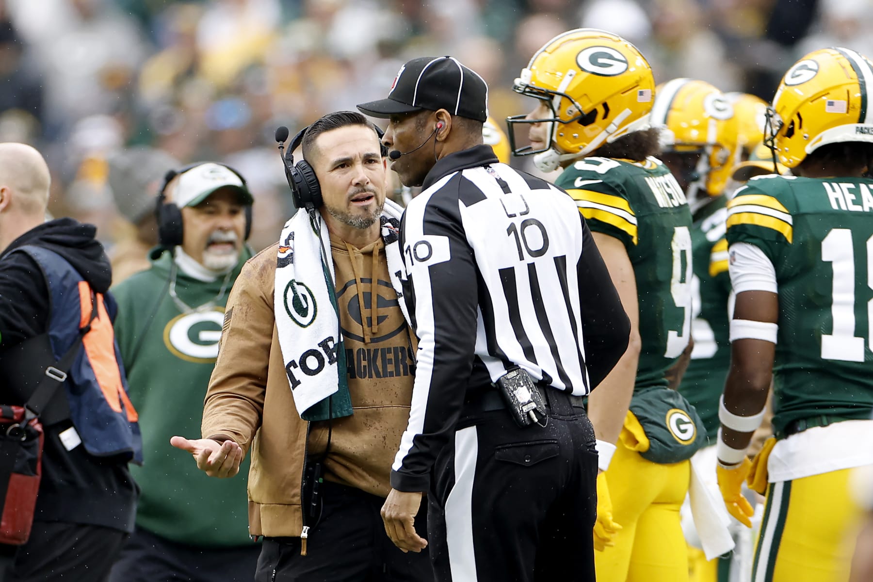 Packers head coach Matt LaFleur talks to NFL line judge Julian Mapp