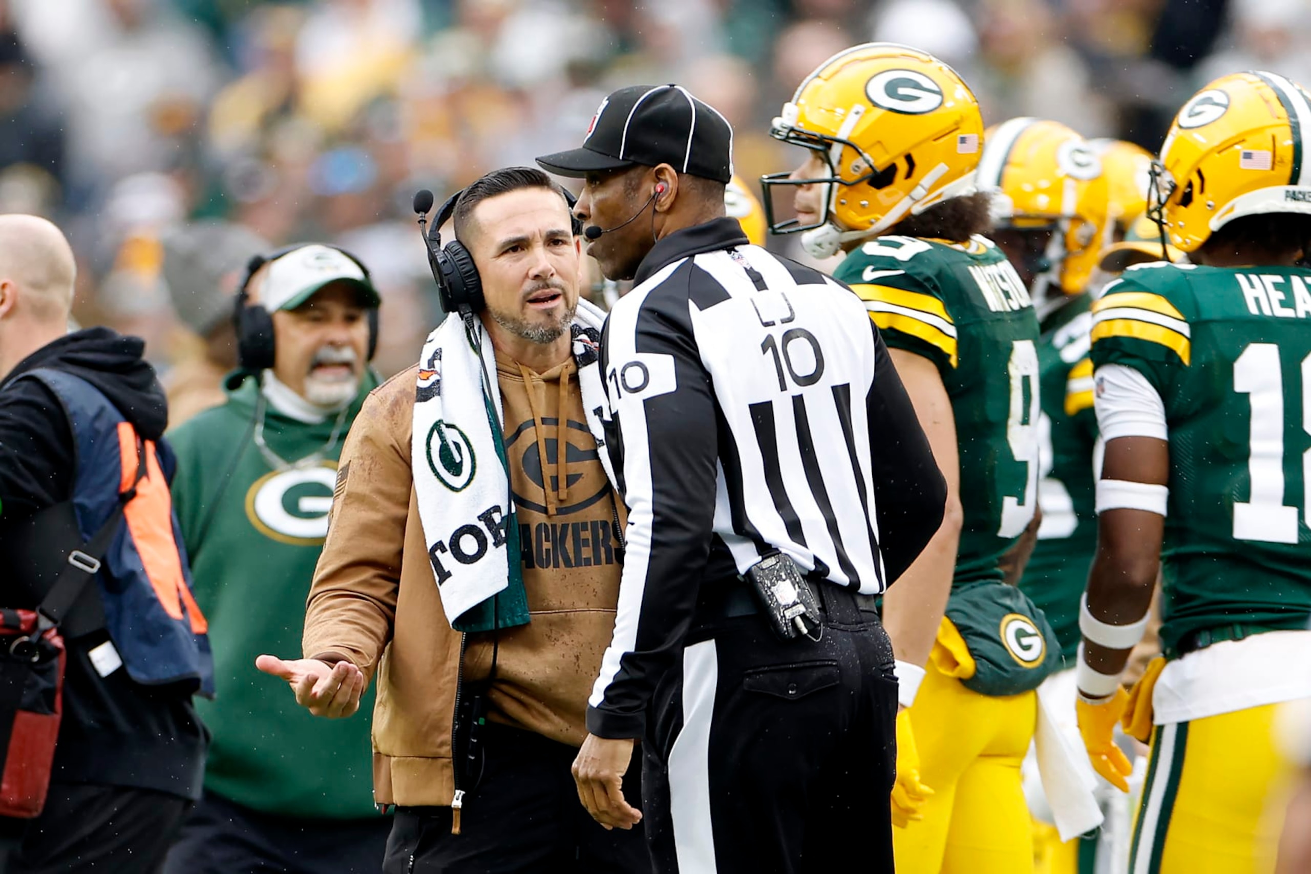 Packers head coach Matt LaFleur talks to NFL line judge Julian Mapp