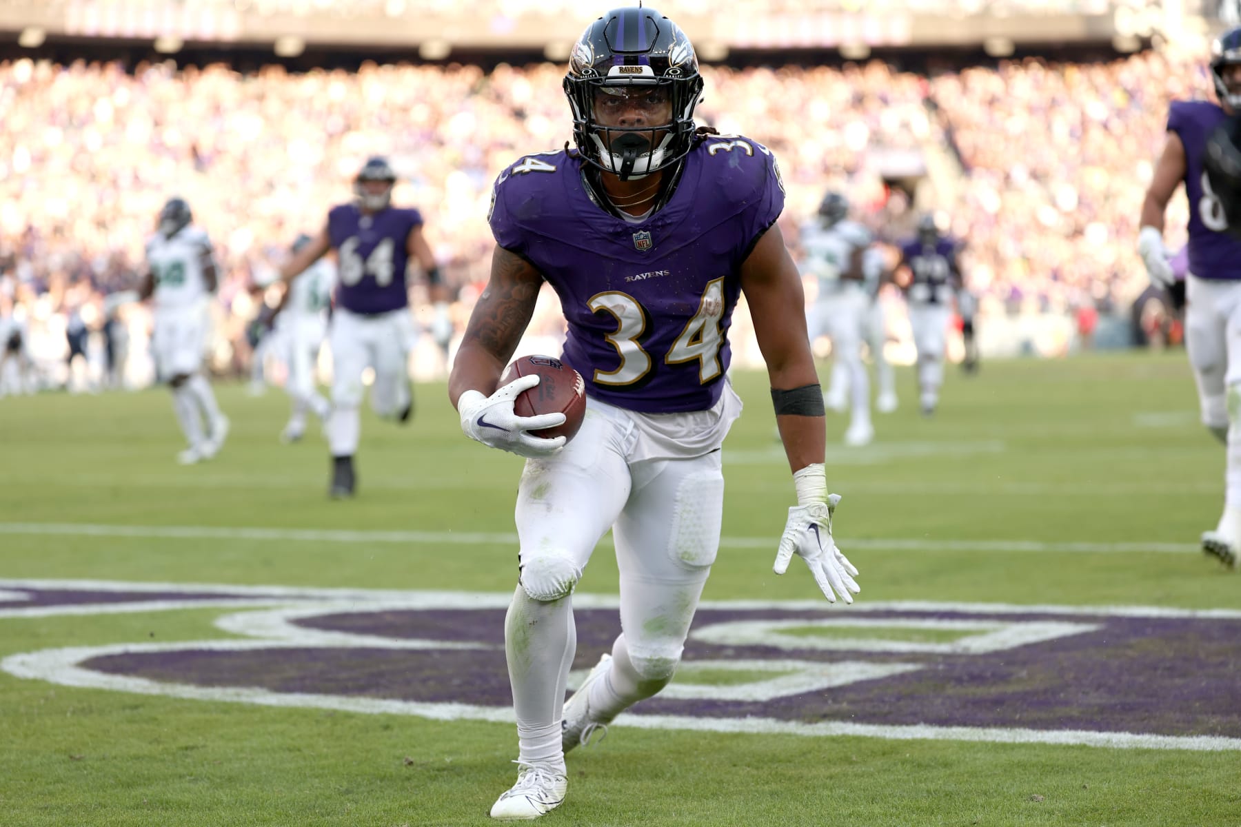 BALTIMORE, MARYLAND - NOVEMBER 05: Keaton Mitchell #34 of the Baltimore Ravens celebrates after a touchdown during the second half in the game against the Seattle Seahawks at M&T Bank Stadium on November 05, 2023 in Baltimore, Maryland. (Photo by Scott Taetsch/Getty Images)