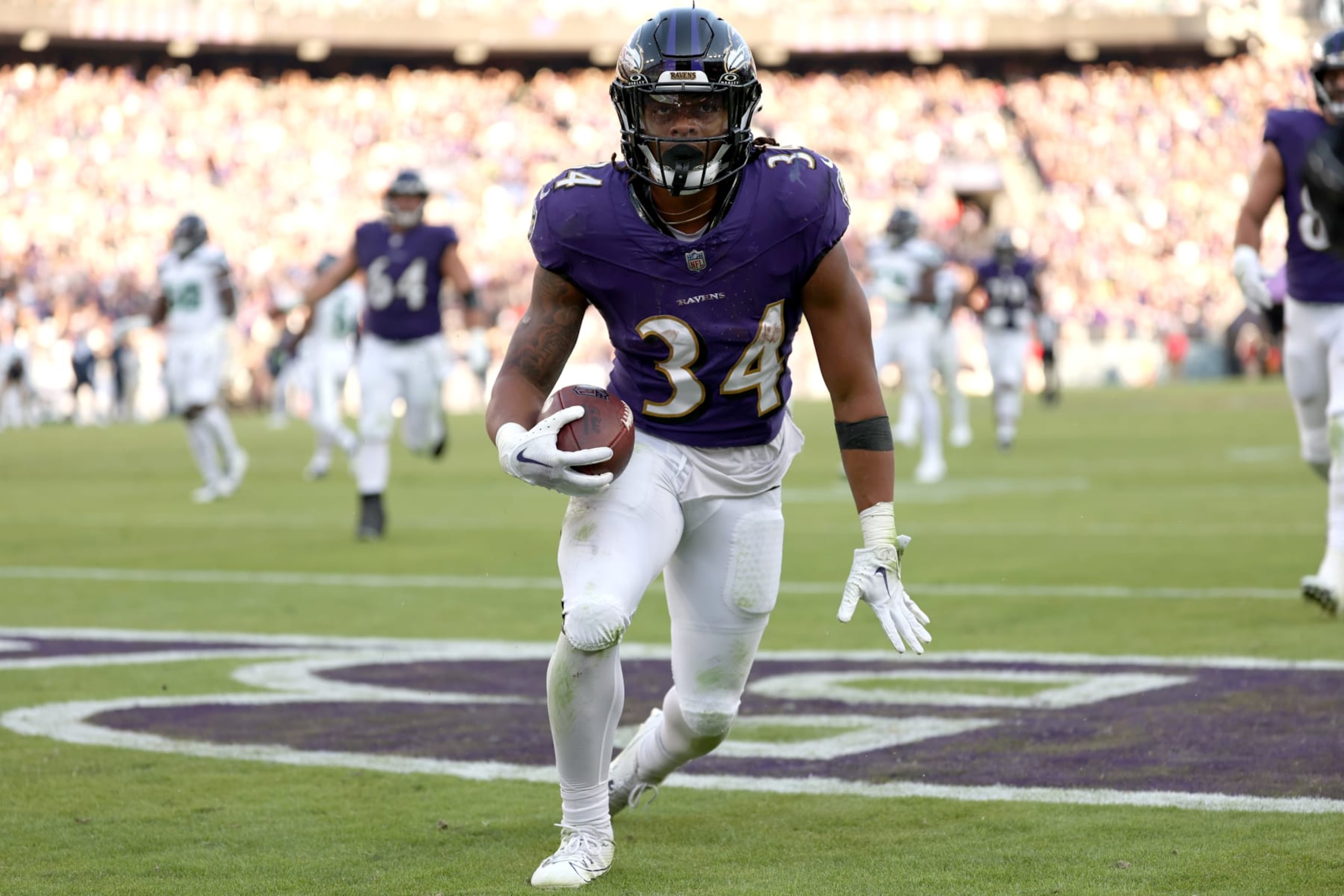 BALTIMORE, MARYLAND - NOVEMBER 05: Keaton Mitchell #34 of the Baltimore Ravens celebrates after a touchdown during the second half in the game against the Seattle Seahawks at M&T Bank Stadium on November 05, 2023 in Baltimore, Maryland. (Photo by Scott Taetsch/Getty Images)