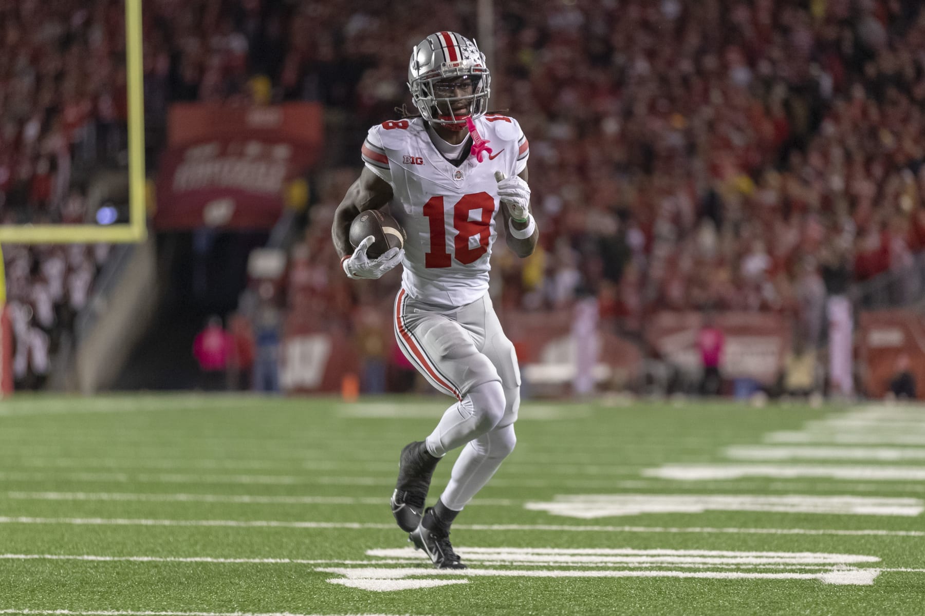 MADISON, WI - OCTOBER 28: Ohio State Buckeyes wide receiver Marvin Harrison Jr. (18) catches a touchdown pass durning a college football game between the Ohio State Buckeyes and the Wisconsin Badgers on October 28th, 2023 at Barry Alvarez field at Camp Randall Stadium in Madison, WI. (Photo by Dan Sanger/Icon Sportswire via Getty Images)