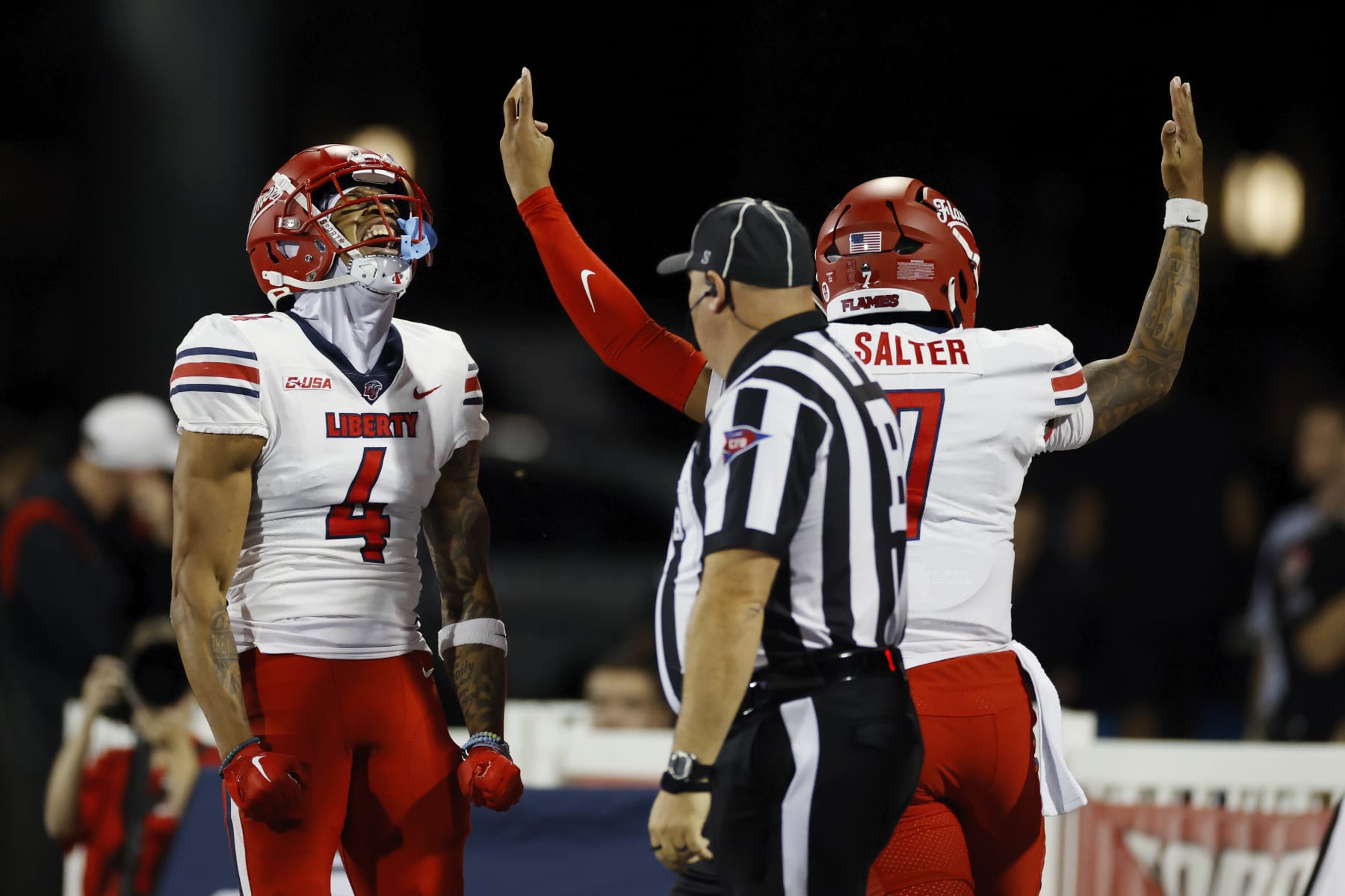 BOWLING GREEN, KY - OCTOBER 24: Liberty Flames quarterback Kaidon Salter (7) celebrates after passing to wide receiver CJ Daniels (4) for a 47-yard touchdown during a college football game against the Western Kentucky Hilltoppers on October 24, 2023 at Houchens Industries - L. T. Smith Stadium in Bowling Green, Kentucky. (Photo by Joe Robbins/Icon Sportswire via Getty Images)