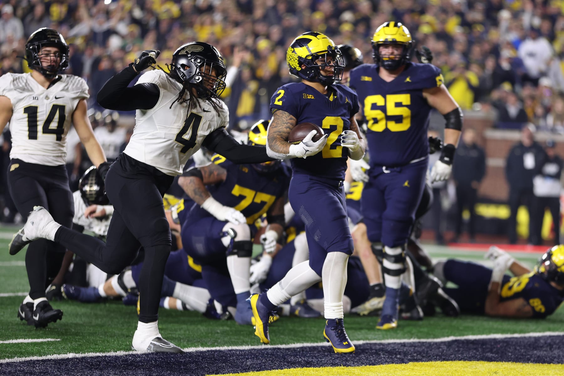 ANN ARBOR, MICHIGAN - NOVEMBER 04: Blake Corum #2 of the Michigan Wolverines scores a second half touchdown against the Purdue Boilermakers at Michigan Stadium on November 04, 2023 in Ann Arbor, Michigan. Michigan won the game 41-13. (Photo by Gregory Shamus/Getty Images)