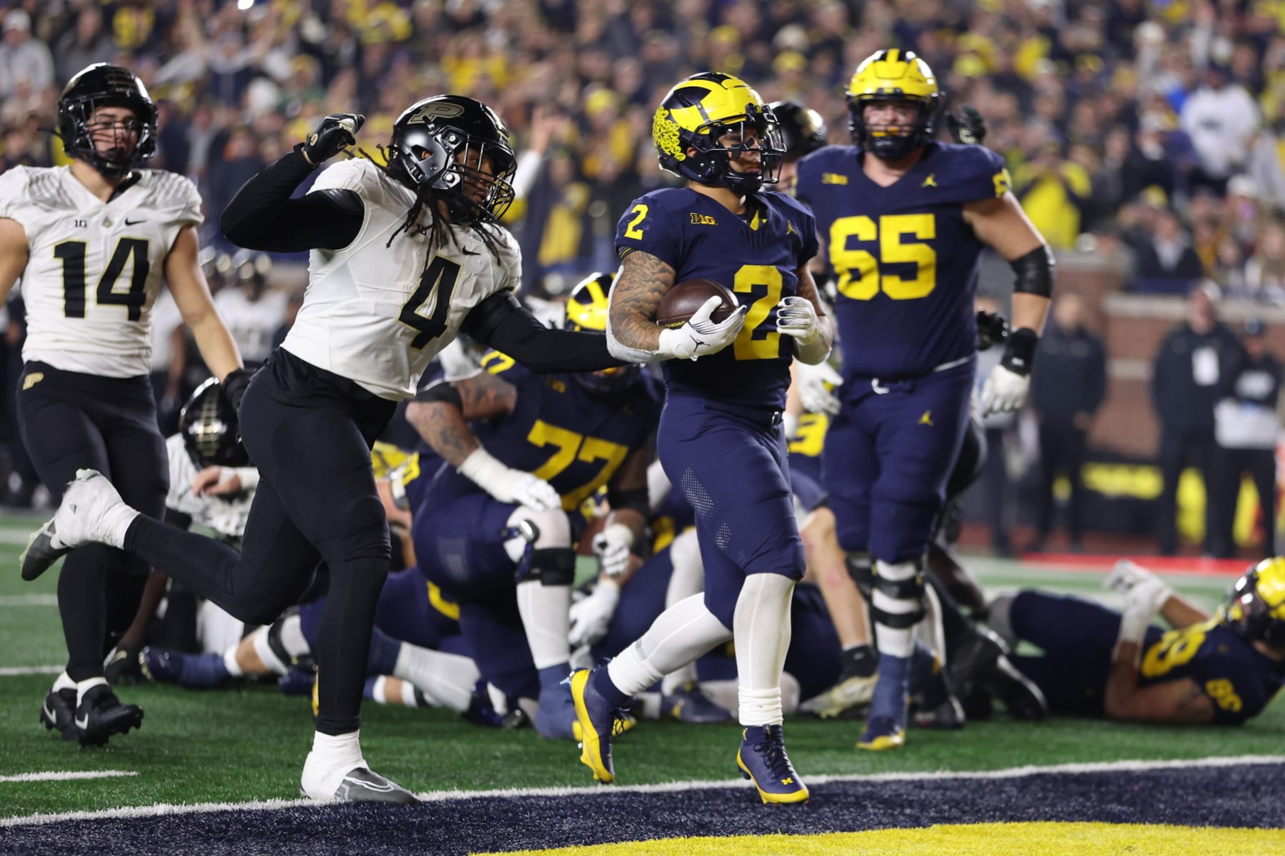ANN ARBOR, MICHIGAN - NOVEMBER 04: Blake Corum #2 of the Michigan Wolverines scores a second half touchdown against the Purdue Boilermakers at Michigan Stadium on November 04, 2023 in Ann Arbor, Michigan. Michigan won the game 41-13. (Photo by Gregory Shamus/Getty Images)