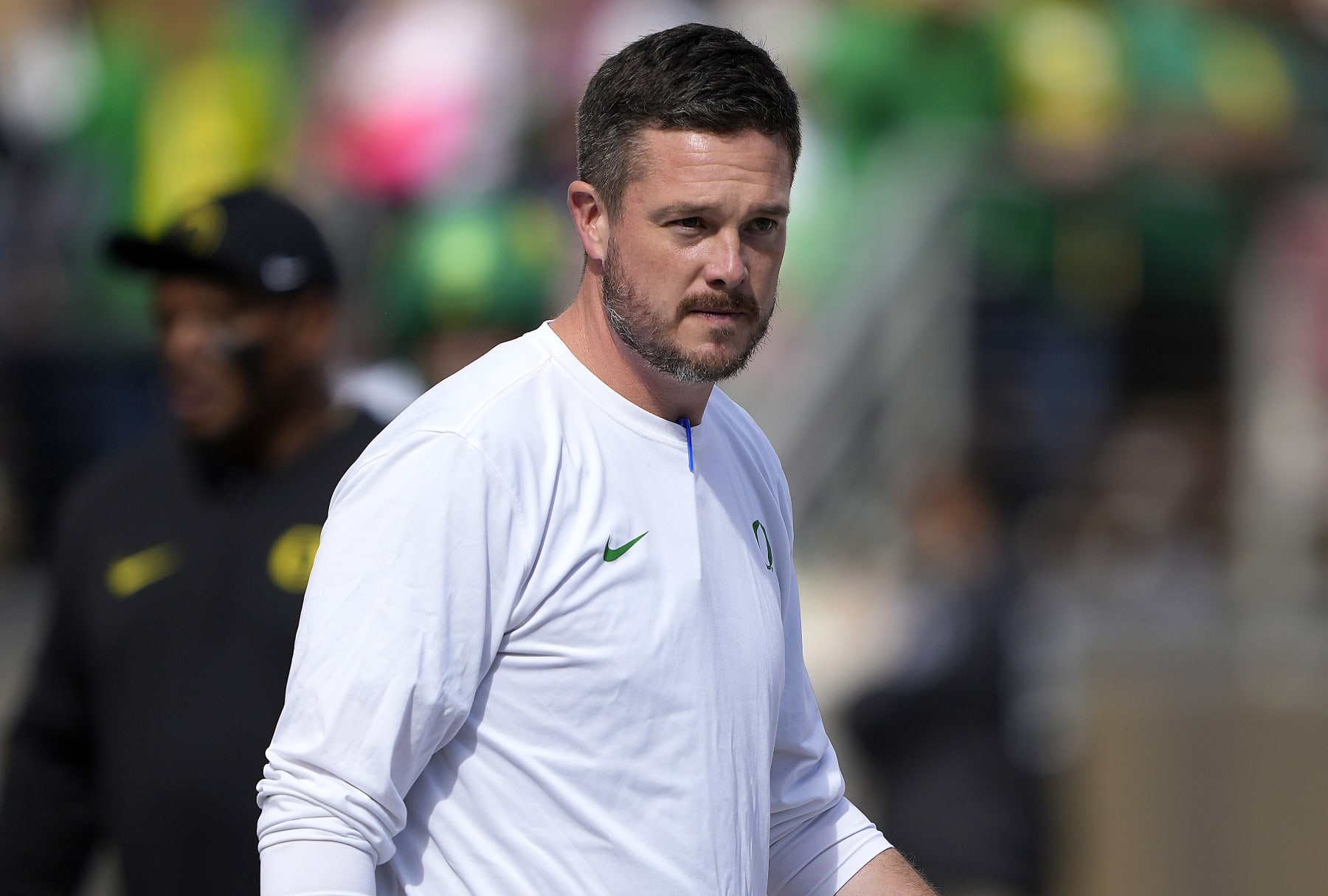 STANFORD, CALIFORNIA - SEPTEMBER 30: Head coach Dan Lanning of the Oregon Ducks looks on while his team warms up prior to playin the Stanford Cardinal in an NCAA football game at Stanford Stadium on September 30, 2023 in Stanford, California. (Photo by Thearon W. Henderson/Getty Images)