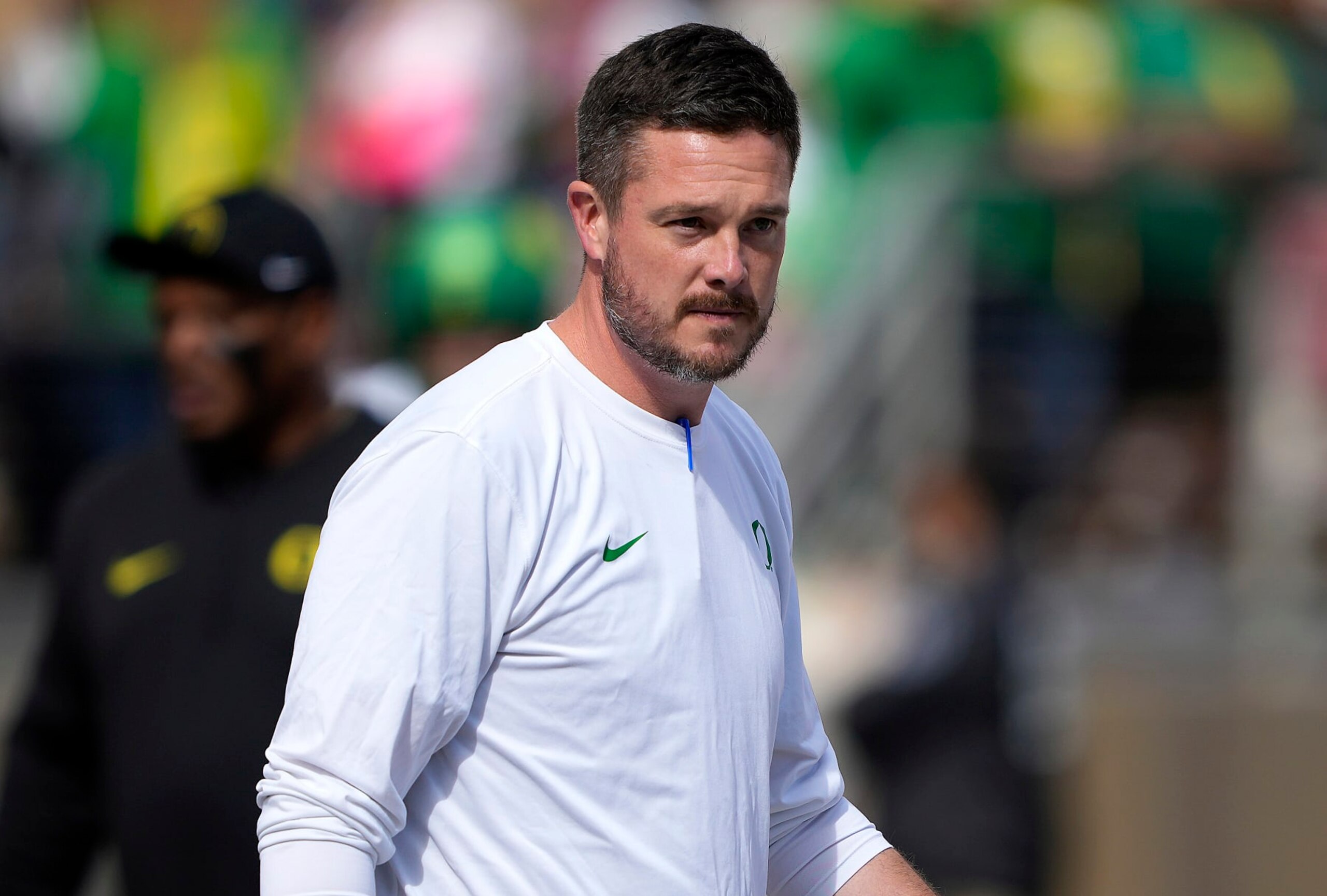 STANFORD, CALIFORNIA - SEPTEMBER 30: Head coach Dan Lanning of the Oregon Ducks looks on while his team warms up prior to playin the Stanford Cardinal in an NCAA football game at Stanford Stadium on September 30, 2023 in Stanford, California. (Photo by Thearon W. Henderson/Getty Images)