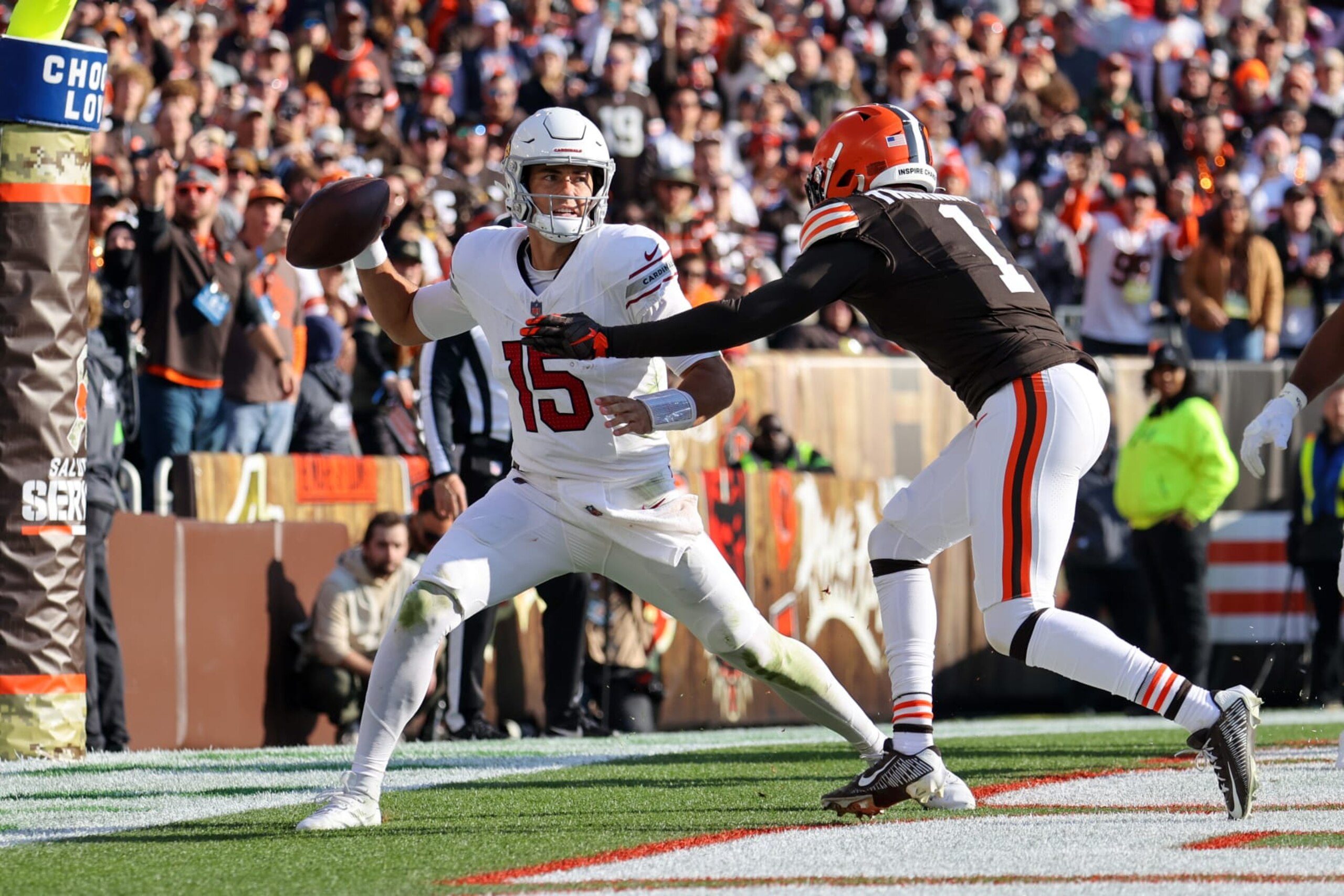 CLEVELAND, OH - NOVEMBER 05: Arizona Cardinals quarterback Clayton Tune (15) is hit as he throws by Cleveland Browns safety Juan Thornhill (1) during the third quarter of the National Football League game between the Arizona Cardinals and Cleveland Browns on November 5, 2023, at Cleveland Browns Stadium in Cleveland, OH. (Photo by Frank Jansky/Icon Sportswire via Getty Images)