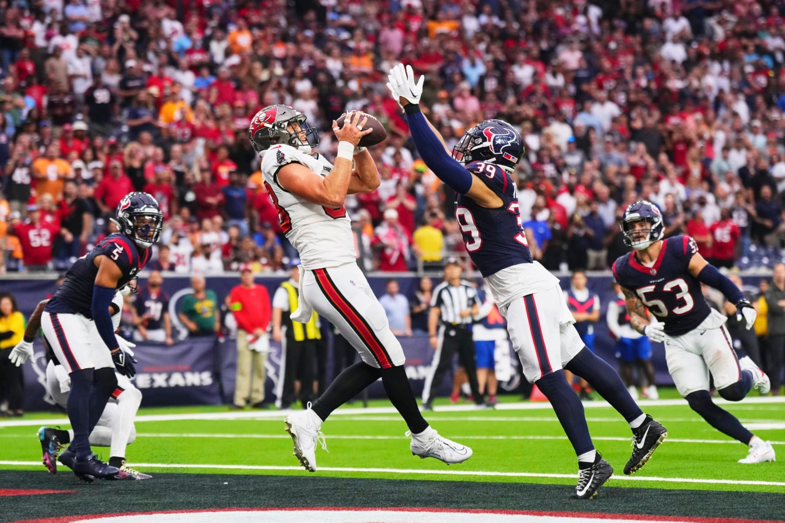 HOUSTON, TX - NOVEMBER 05: Cade Otton #88 of the Tampa Bay Buccaneers catches a touchdown pass against the Houston Texans during the second half at NRG Stadium on November 5, 2023 in Houston, Texas. (Photo by Cooper Neill/Getty Images)