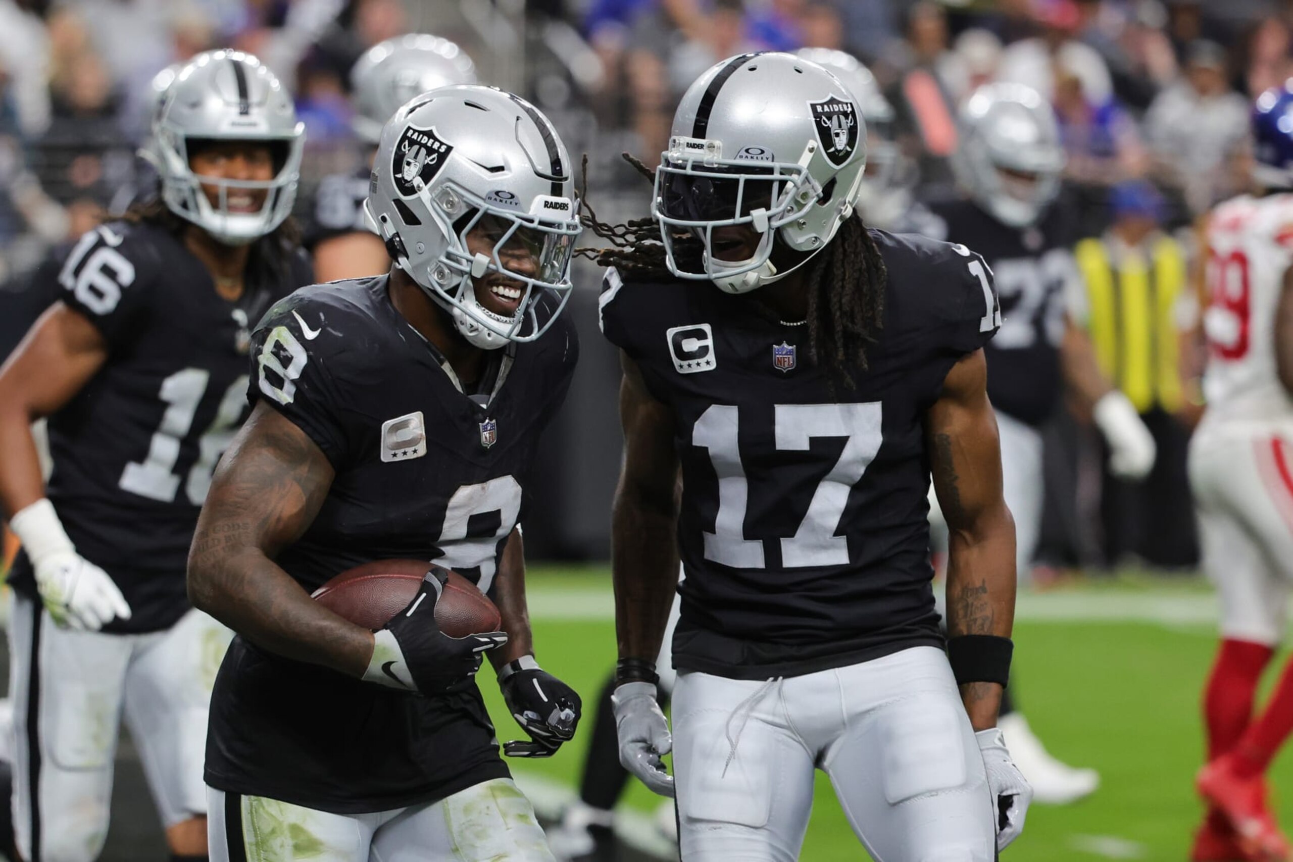 LAS VEGAS, NEVADA - NOVEMBER 05: Josh Jacobs #8 of the Las Vegas Raiders celebrates with Davante Adams #17 after scoring a touchdown in the second quarter of a game against the New York Giants at Allegiant Stadium on November 05, 2023 in Las Vegas, Nevada. (Photo by Ethan Miller/Getty Images)
