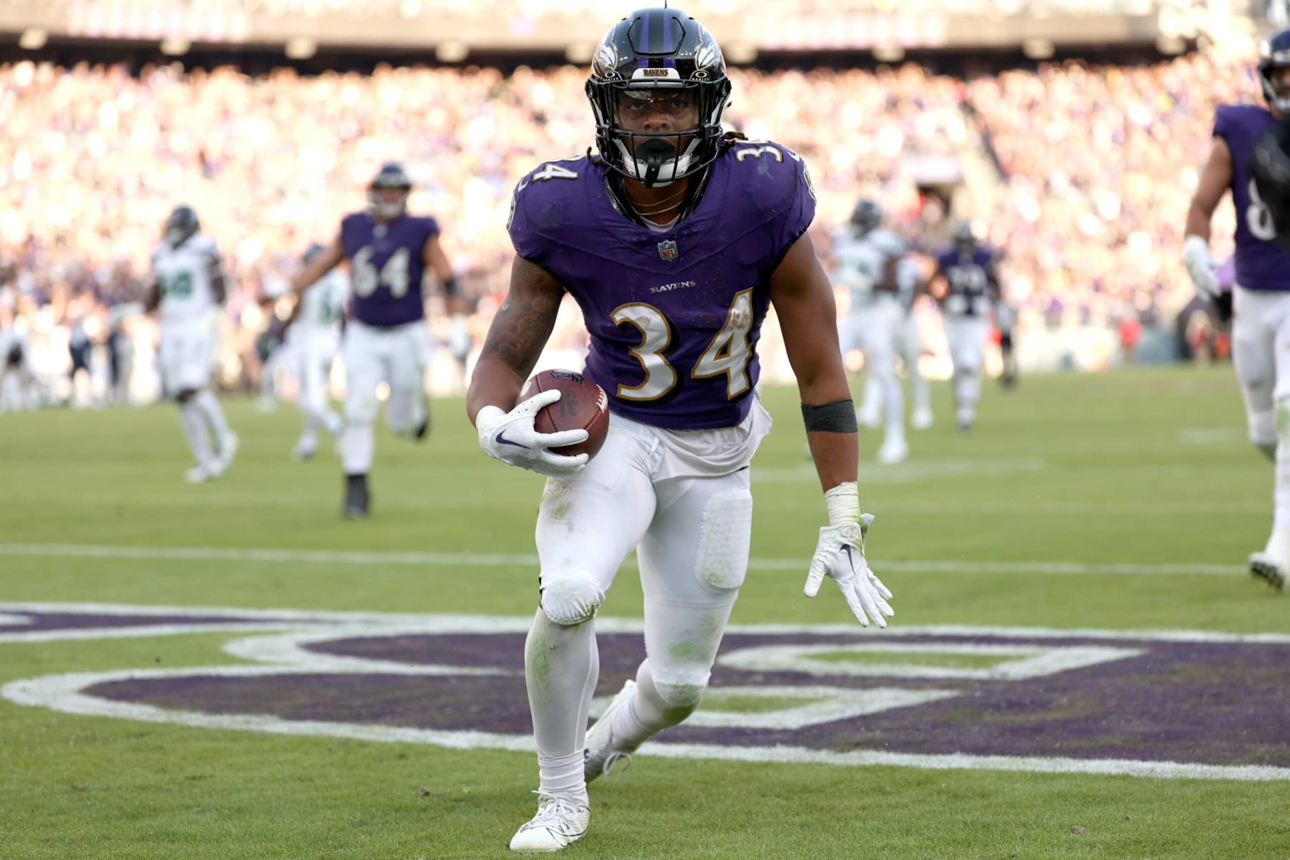 BALTIMORE, MARYLAND - NOVEMBER 05: Keaton Mitchell #34 of the Baltimore Ravens celebrates after a touchdown during the second half in the game against the Seattle Seahawks at M&T Bank Stadium on November 05, 2023 in Baltimore, Maryland. (Photo by Scott Taetsch/Getty Images)