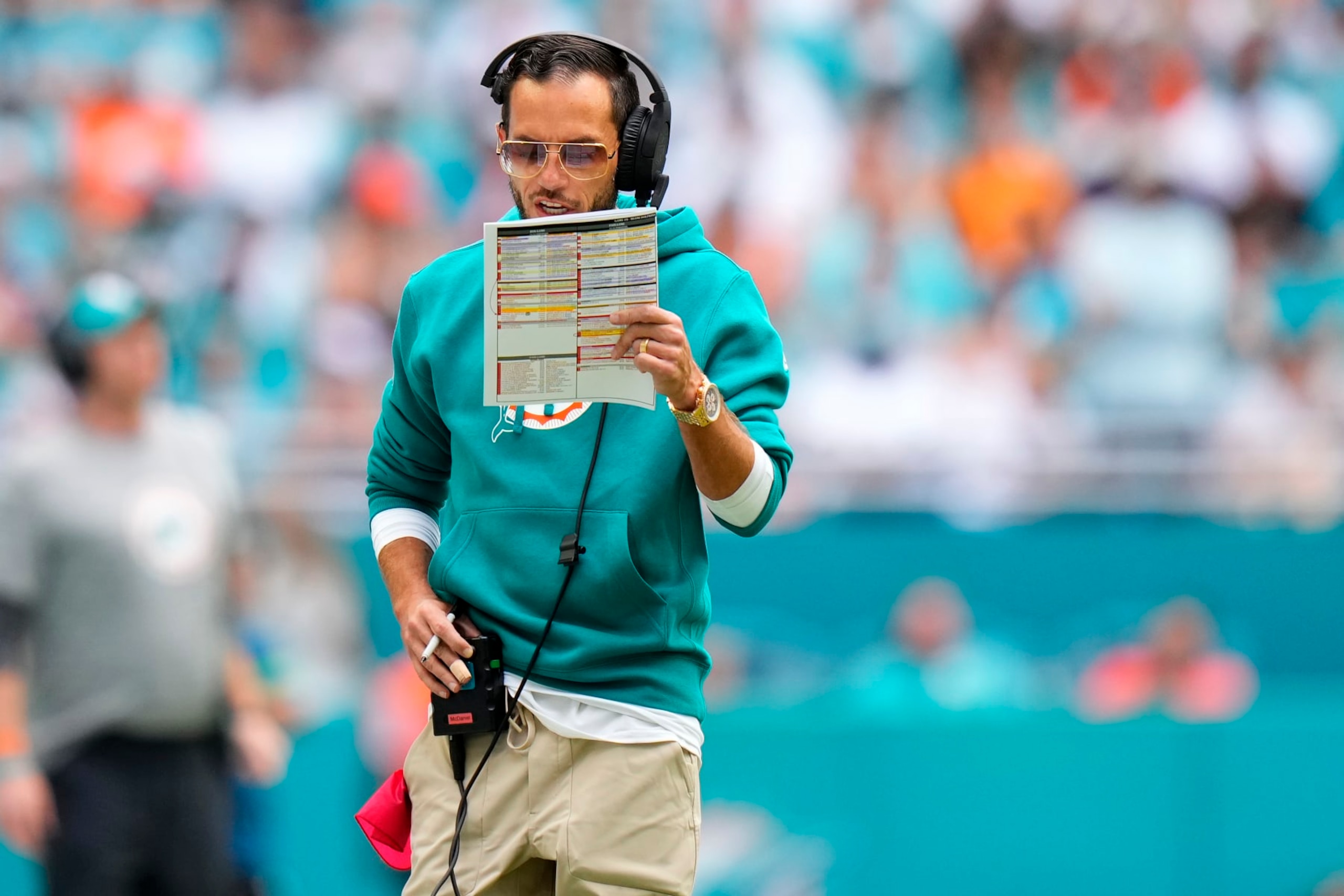 MIAMI GARDENS, FLORIDA - OCTOBER 29: Head coach Mike McDaniel of the Miami Dolphins looks at his play sheet during the second quarter against the New England Patriots at Hard Rock Stadium on October 29, 2023 in Miami Gardens, Florida. (Photo by Rich Storry/Getty Images)