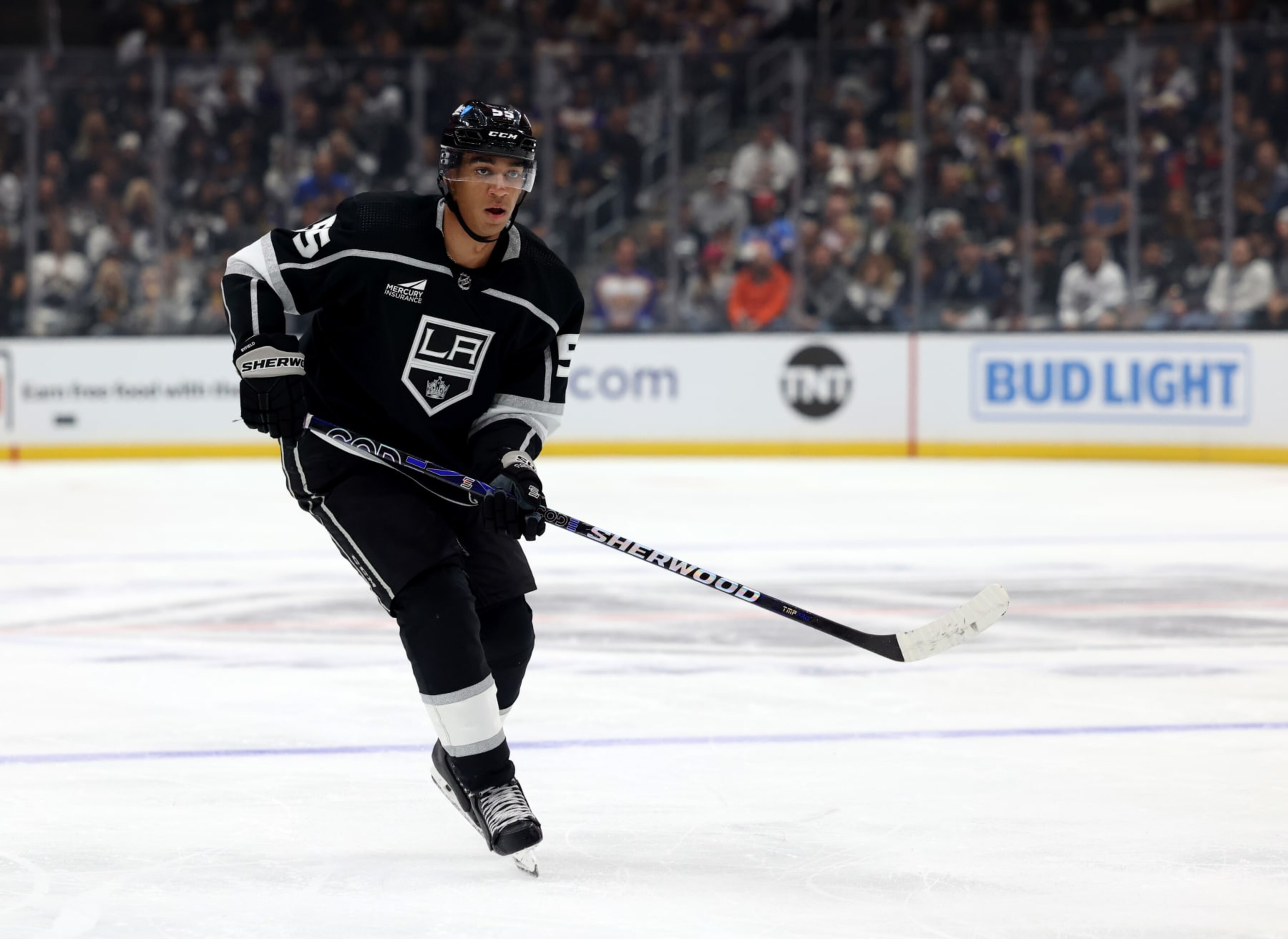 LOS ANGELES, CALIFORNIA - OCTOBER 11: Quinton Byfield #55 of the Los Angeles Kings watches his passduring a 5-3 loss to the Colorado Avalanche in the Los Angeles Kings season opening game at Crypto.com Arena on October 11, 2023 in Los Angeles, California. (Photo by Harry How/Getty Images) LOS ANGELES, CALIFORNIA - OCTOBER 11: Quinton Byfield #55 of the Los Angeles Kings watches his passduring a 5-3 loss to the Colorado Avalanche in the Los Angeles Kings season opening game at Crypto.com Arena on October 11, 2023 in Los Angeles, California. (Photo by Harry How/Getty Images)