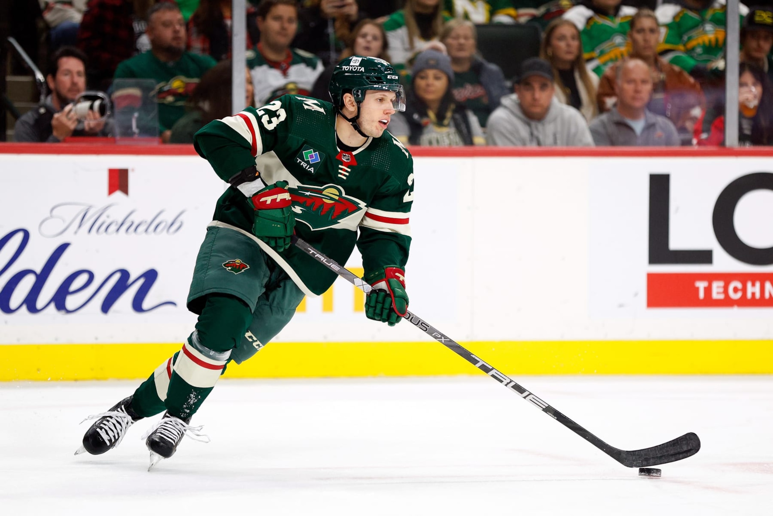 ST PAUL, MINNESOTA - OCTOBER 24: Marco Rossi #23 of the Minnesota Wild skates with the puck in the first period against the Edmonton Oilers at Xcel Energy Center on October 24, 2023 in St Paul, Minnesota. (Photo by David Berding/Getty Images)