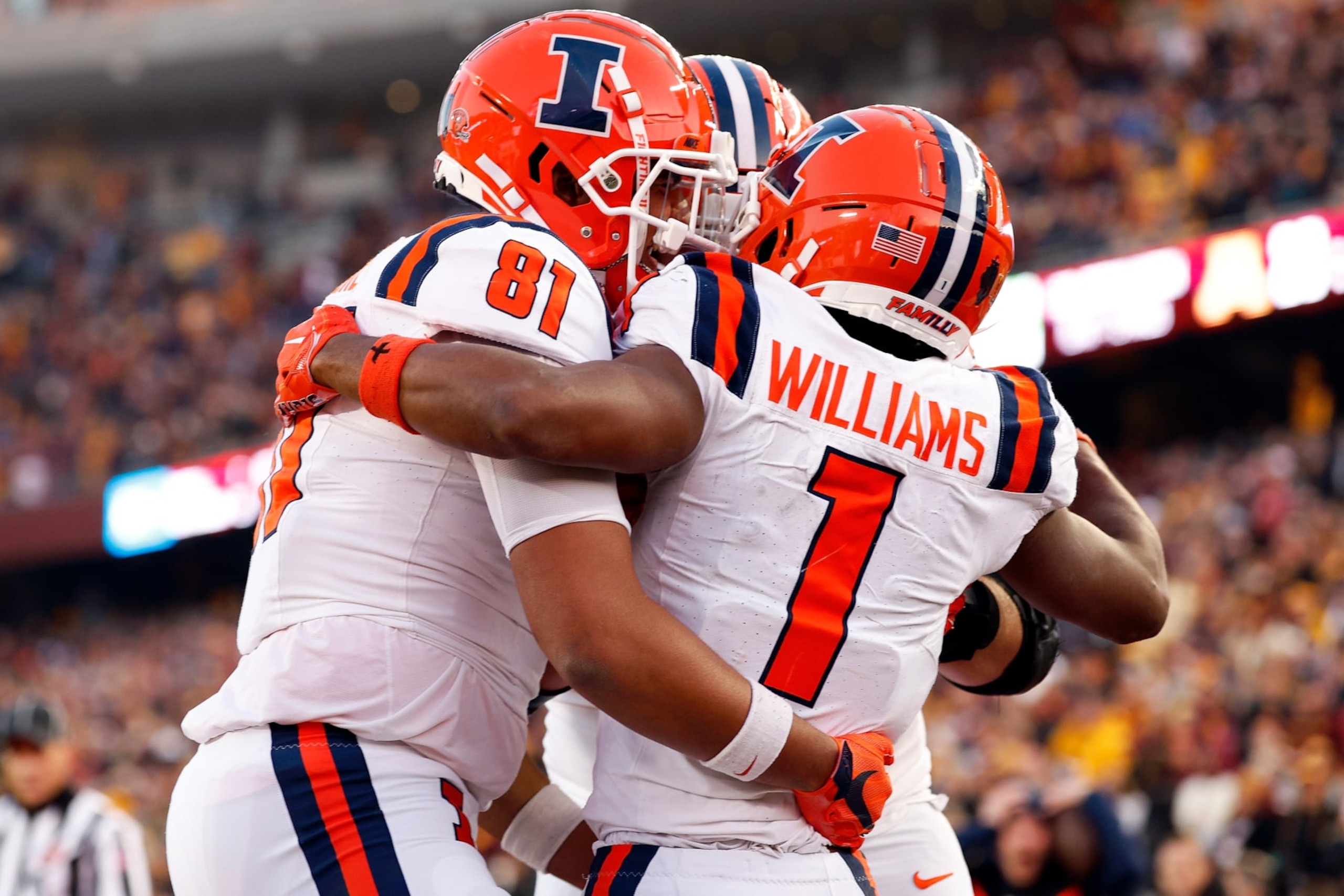 MINNEAPOLIS, MINNESOTA - NOVEMBER 04: Isaiah Williams #1 of the Illinois Fighting Illini celebrates his go-ahead touchdown against the Minnesota Golden Gophers with teammates in the second half at Huntington Bank Stadium on November 04, 2023 in Minneapolis, Minnesota. The Fighting Illini defeated the Golden Gophers 27-26. (Photo by David Berding/Getty Images)