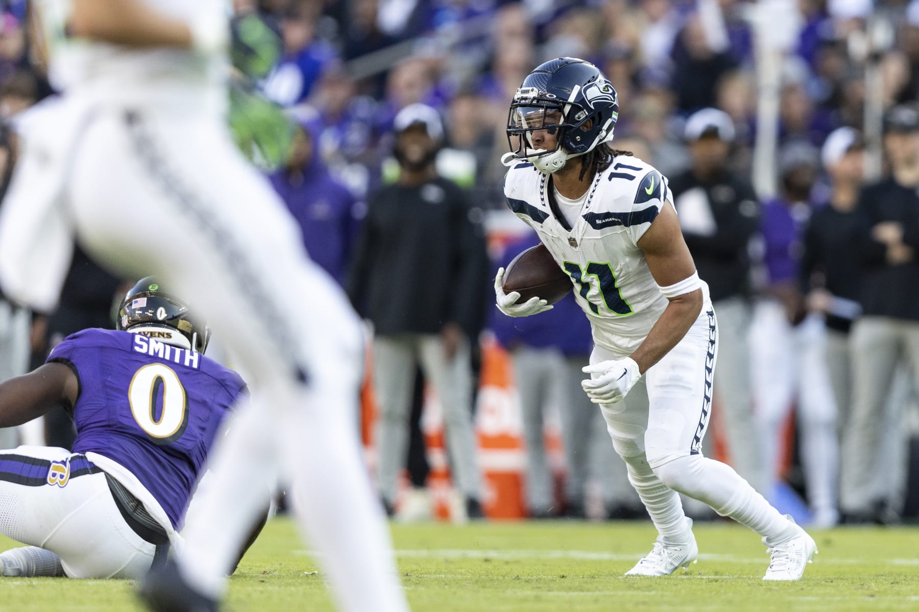 BALTIMORE, MARYLAND - NOVEMBER 05: Jaxon Smith-Njigba #11 of the Seattle Seahawks runs with the ball during an NFL football game between the Baltimore Ravens and the Seattle Seahawks at M&T Bank Stadium on November 05, 2023 in Baltimore, Maryland. (Photo by Michael Owens/Getty Images)