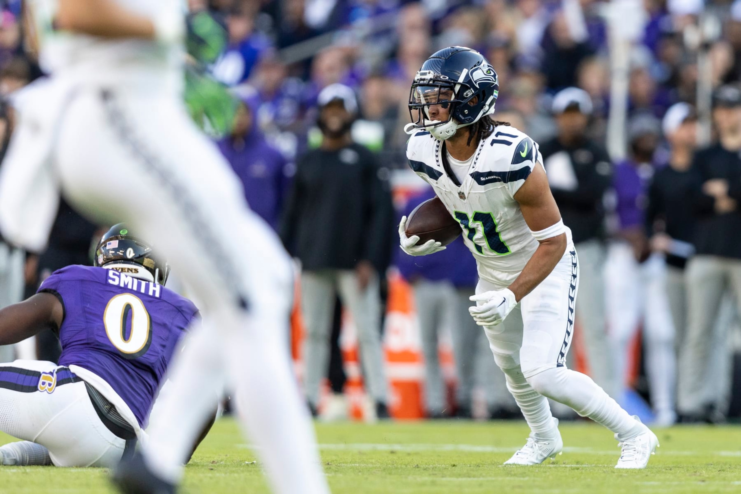 BALTIMORE, MARYLAND - NOVEMBER 05: Jaxon Smith-Njigba #11 of the Seattle Seahawks runs with the ball during an NFL football game between the Baltimore Ravens and the Seattle Seahawks at M&T Bank Stadium on November 05, 2023 in Baltimore, Maryland. (Photo by Michael Owens/Getty Images)