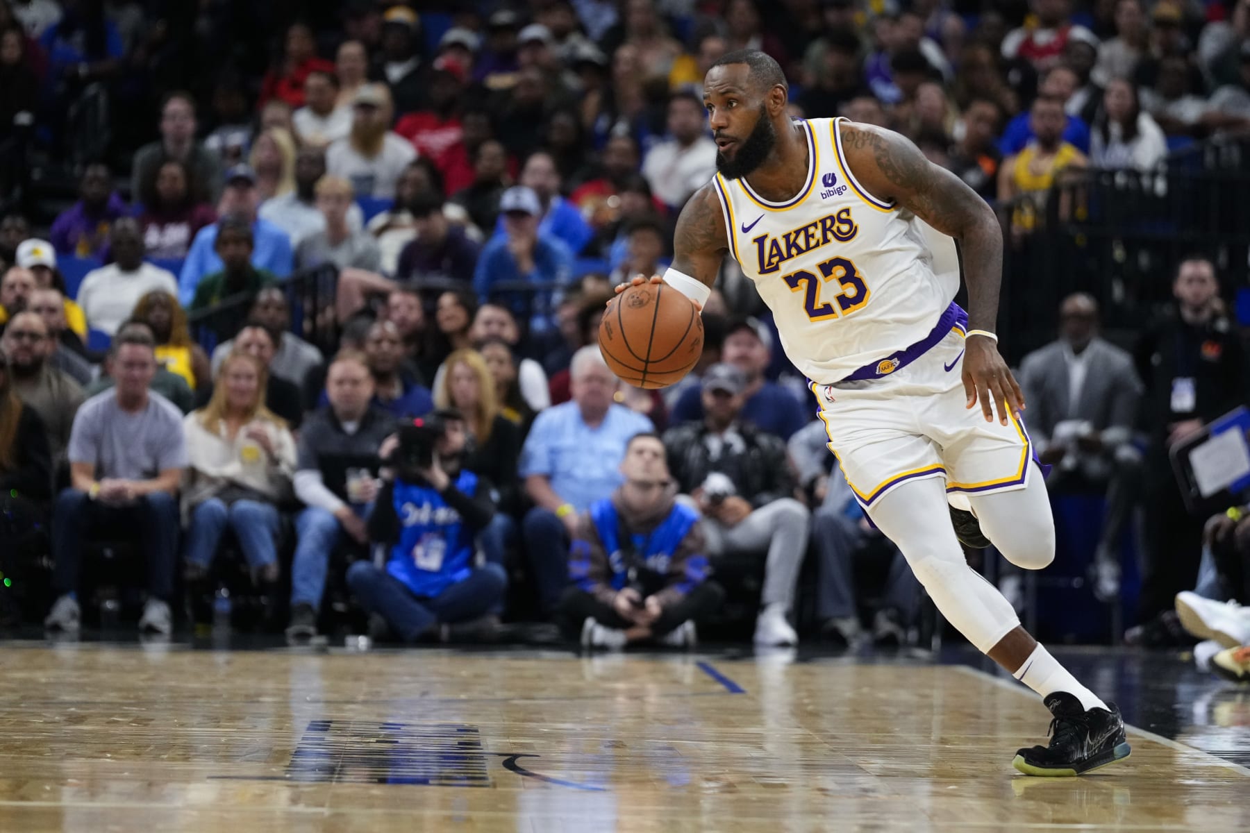 ORLANDO, FLORIDA - NOVEMBER 04: LeBron James #23 of the Los Angeles Lakers dribbles the ball up the court against the Orlando Magic during the first half at Amway Center on November 04, 2023 in Orlando, Florida. NOTE TO USER: User expressly acknowledges and agrees that, by downloading and or using this photograph, User is consenting to the terms and conditions of the Getty Images License Agreement. (Photo by Rich Storry/Getty Images)