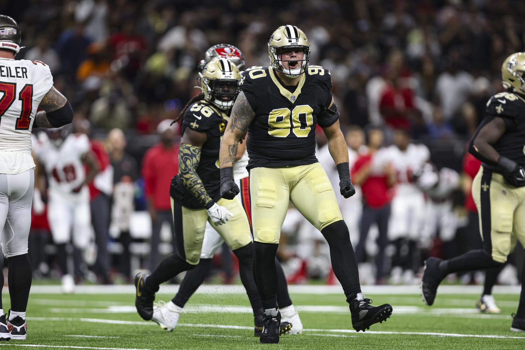 NEW ORLEANS, LA - OCTOBER 01: Bryan Bresee #90 of the New Orleans Saints celebrates during an NFL football game against the Tampa Bay Buccaneers at Caesars Superdome on October 1, 2023 in New Orleans, Louisiana. (Photo by Perry Knotts/Getty Images)