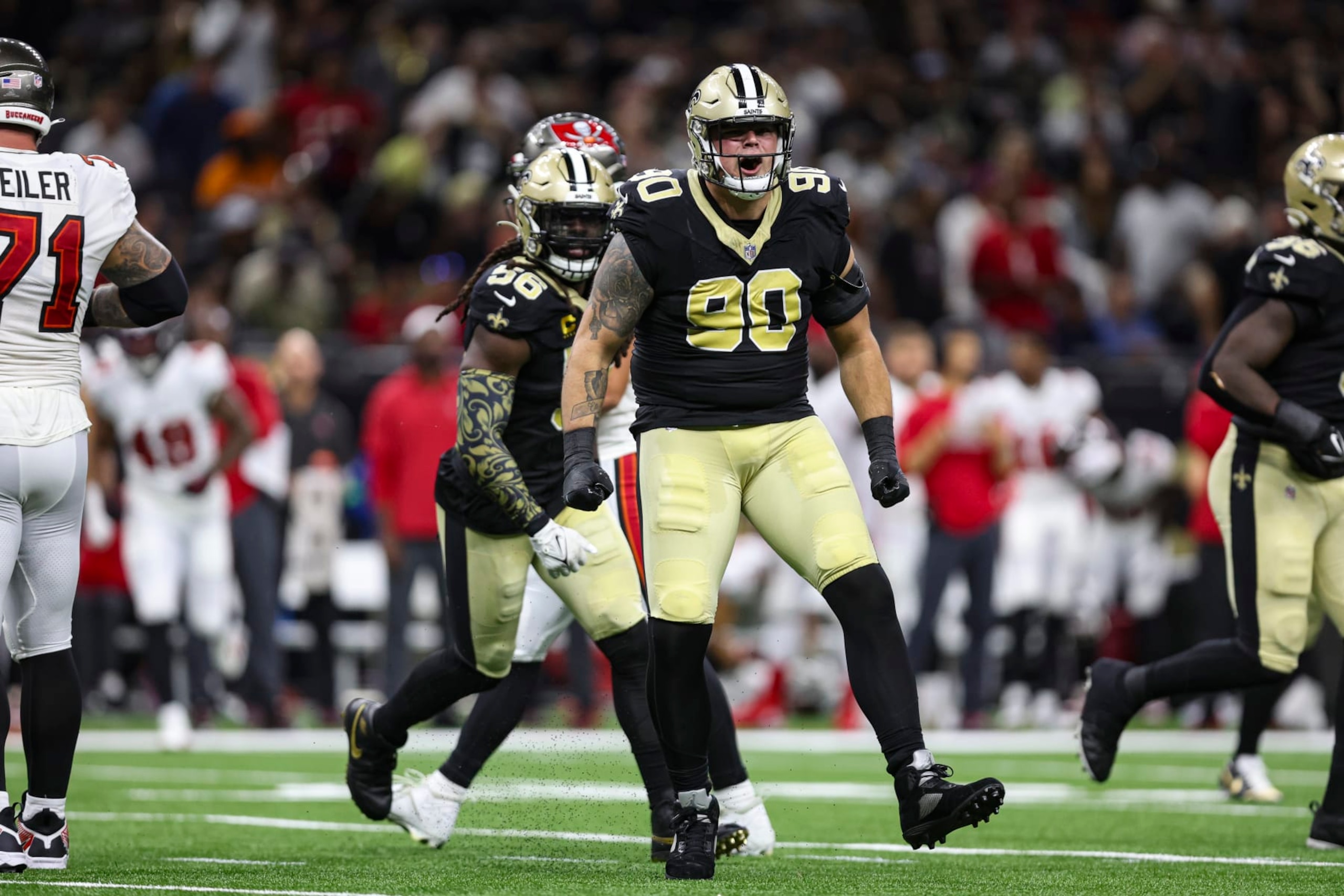 NEW ORLEANS, LA - OCTOBER 01: Bryan Bresee #90 of the New Orleans Saints celebrates during an NFL football game against the Tampa Bay Buccaneers at Caesars Superdome on October 1, 2023 in New Orleans, Louisiana. (Photo by Perry Knotts/Getty Images)
