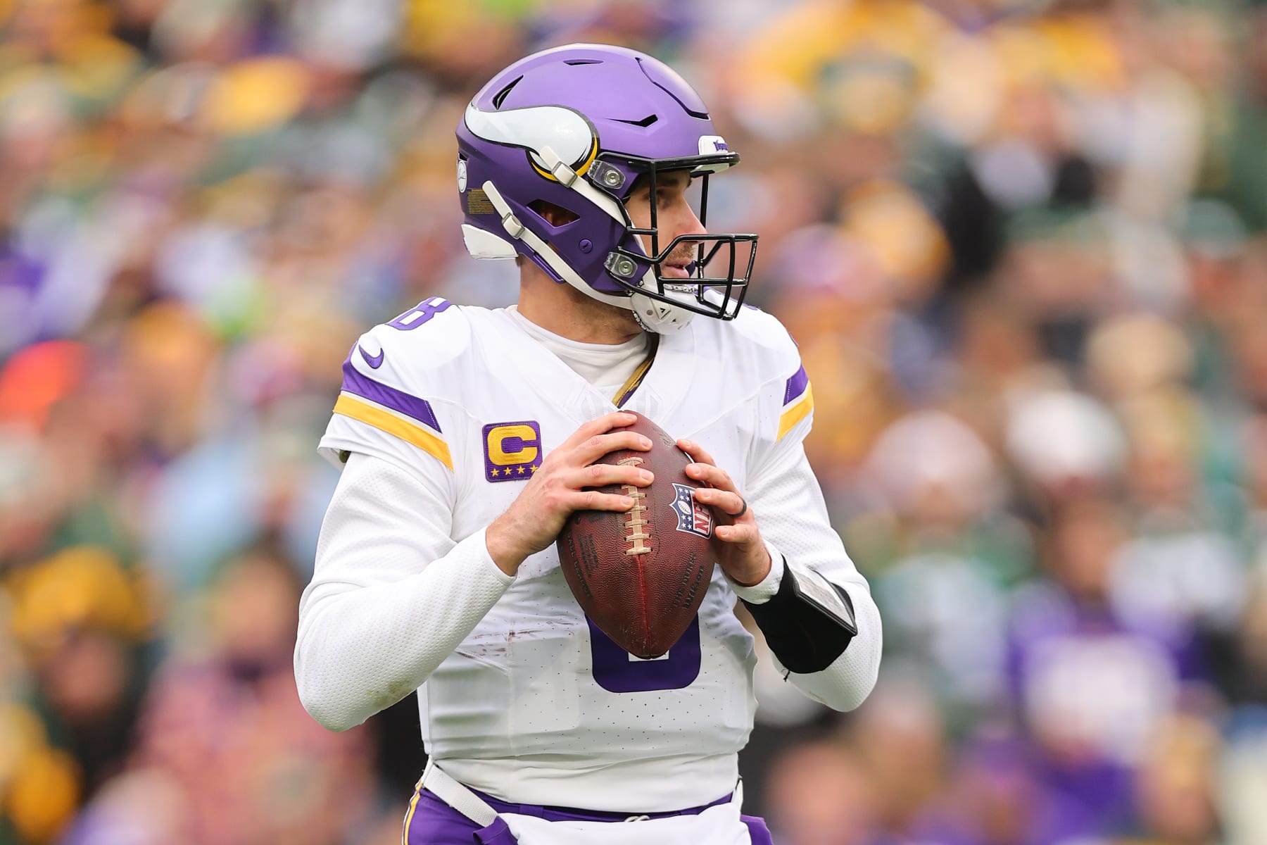 GREEN BAY, WISCONSIN - OCTOBER 29: Kirk Cousins #8 of the Minnesota Vikings looks to pass against the Green Bay Packers at Lambeau Field on October 29, 2023 in Green Bay, Wisconsin. (Photo by Michael Reaves/Getty Images)