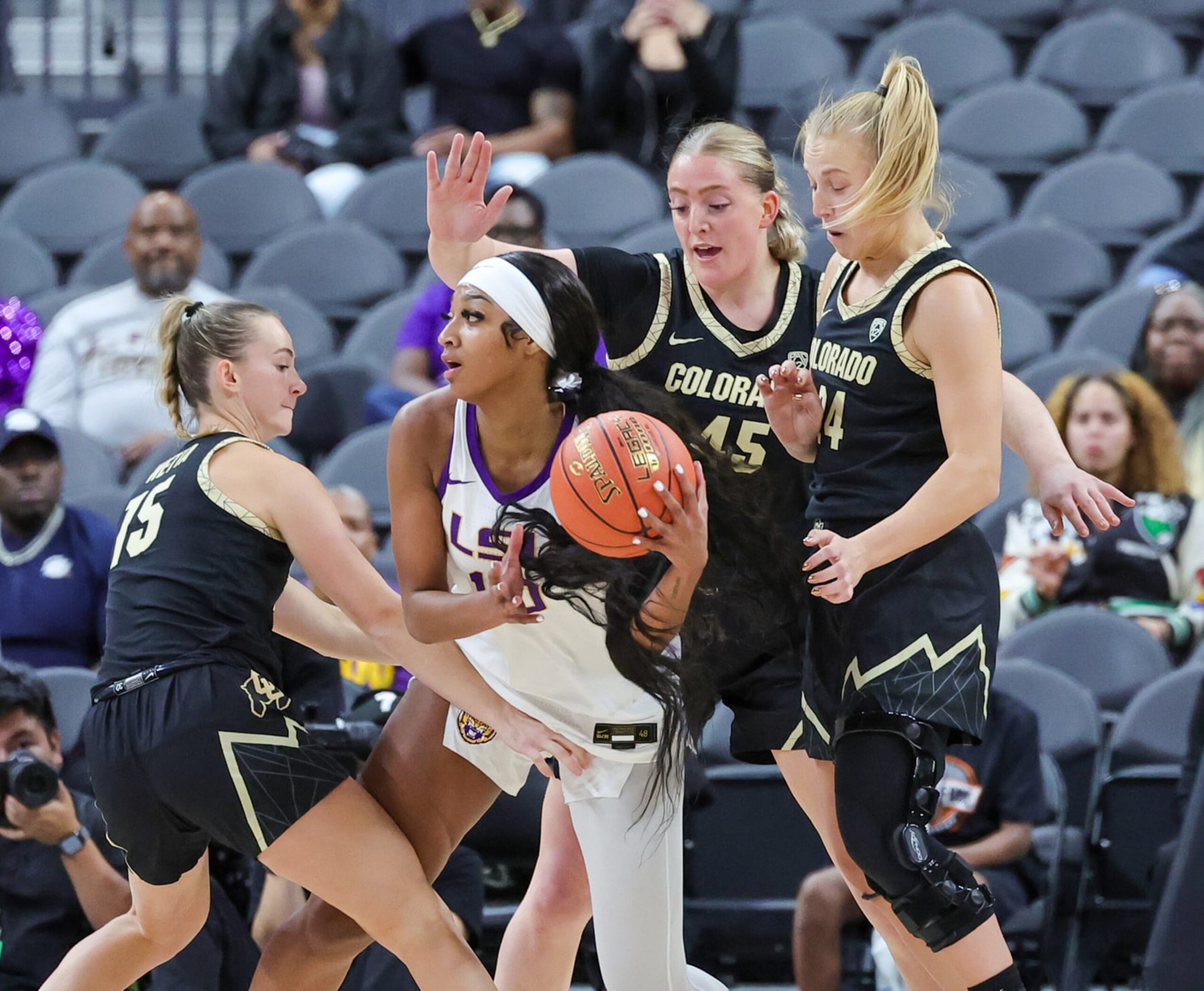 LAS VEGAS, NEVADA - NOVEMBER 06: Angel Reese #10 of the LSU Lady Tigers is guarded by Kindyll Wetta #15, Charlotte Whittaker #45 and Maddie Nolan #24 of the Colorado Buffaloes in the first half of their game during the Naismith Basketball Hall of Fame Series at T-Mobile Arena on November 06, 2023 in Las Vegas, Nevada. (Photo by Ethan Miller/Getty Images) LAS VEGAS, NEVADA - NOVEMBER 06: Angel Reese #10 of the LSU Lady Tigers is guarded by Kindyll Wetta #15, Charlotte Whittaker #45 and Maddie Nolan #24 of the Colorado Buffaloes in the first half of their game during the Naismith Basketball Hall of Fame Series at T-Mobile Arena on November 06, 2023 in Las Vegas, Nevada. (Photo by Ethan Miller/Getty Images)