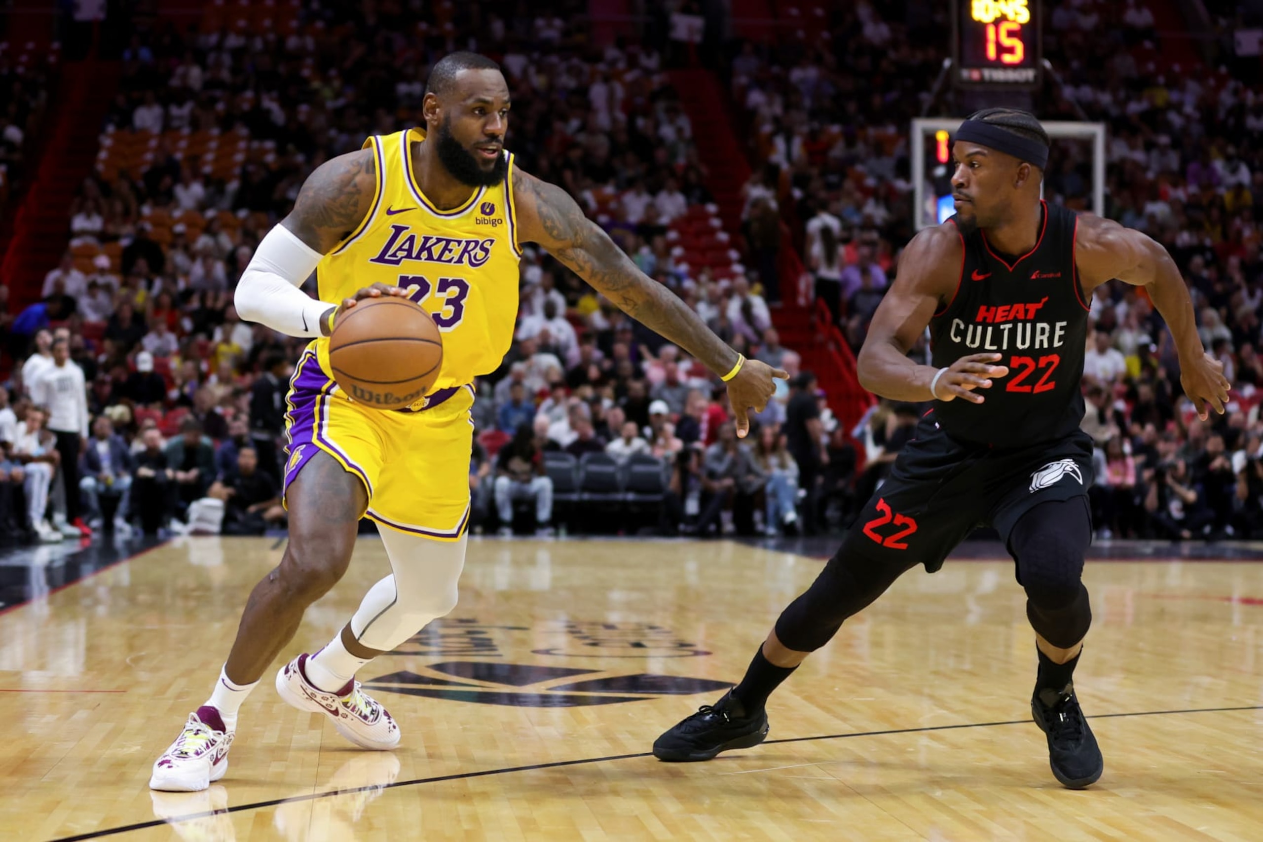 MIAMI, FLORIDA - NOVEMBER 06: LeBron James #23 of the Los Angeles Lakers drives against Jimmy Butler #22 of the Miami Heat during the first quarter of the game at Kaseya Center on November 06, 2023 in Miami, Florida. NOTE TO USER: User expressly acknowledges and agrees that, by downloading and or using this photograph, User is consenting to the terms and conditions of the Getty Images License Agreement. (Photo by Megan Briggs/Getty Images)