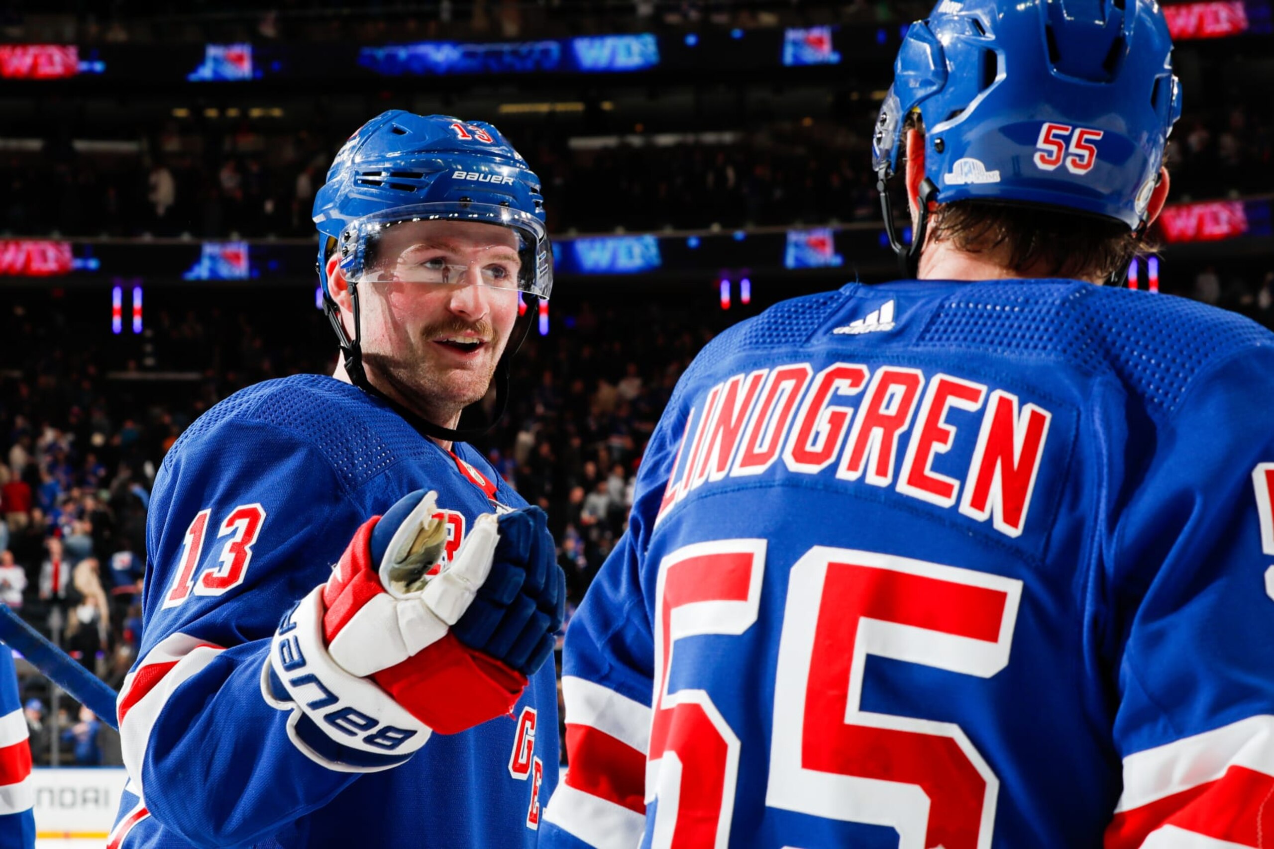 NEW YORK, NEW YORK - NOVEMBER 02:  Alexis Lafreniere #13 and Ryan Lindgren #55 of the New York Rangers celebrate a 2-1 win against the Carolina Hurricanes at Madison Square Garden on November 2, 2023 in New York City. (Photo by Jared Silber/NHLI via Getty Images)