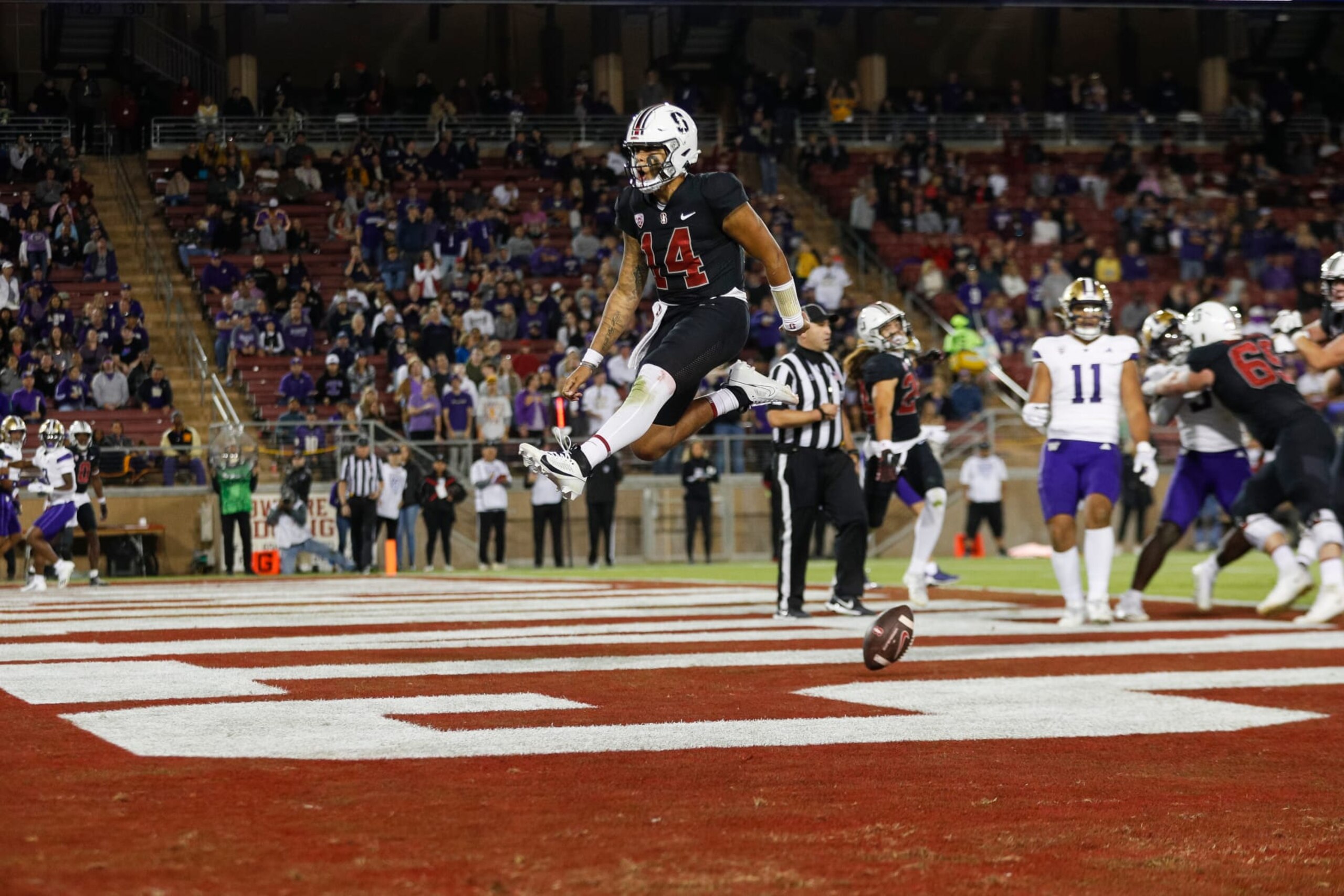 STANFORD, CALIFORNIA - OCTOBER 28: Ashton Daniels #14 of the Stanford Cardinal runs for a touchdown in the second half during a game against the Washington Huskies at Stanford Stadium on October 28, 2023 in Stanford, California. (Photo by Brandon Sloter/Image Of Sport/Getty Images)