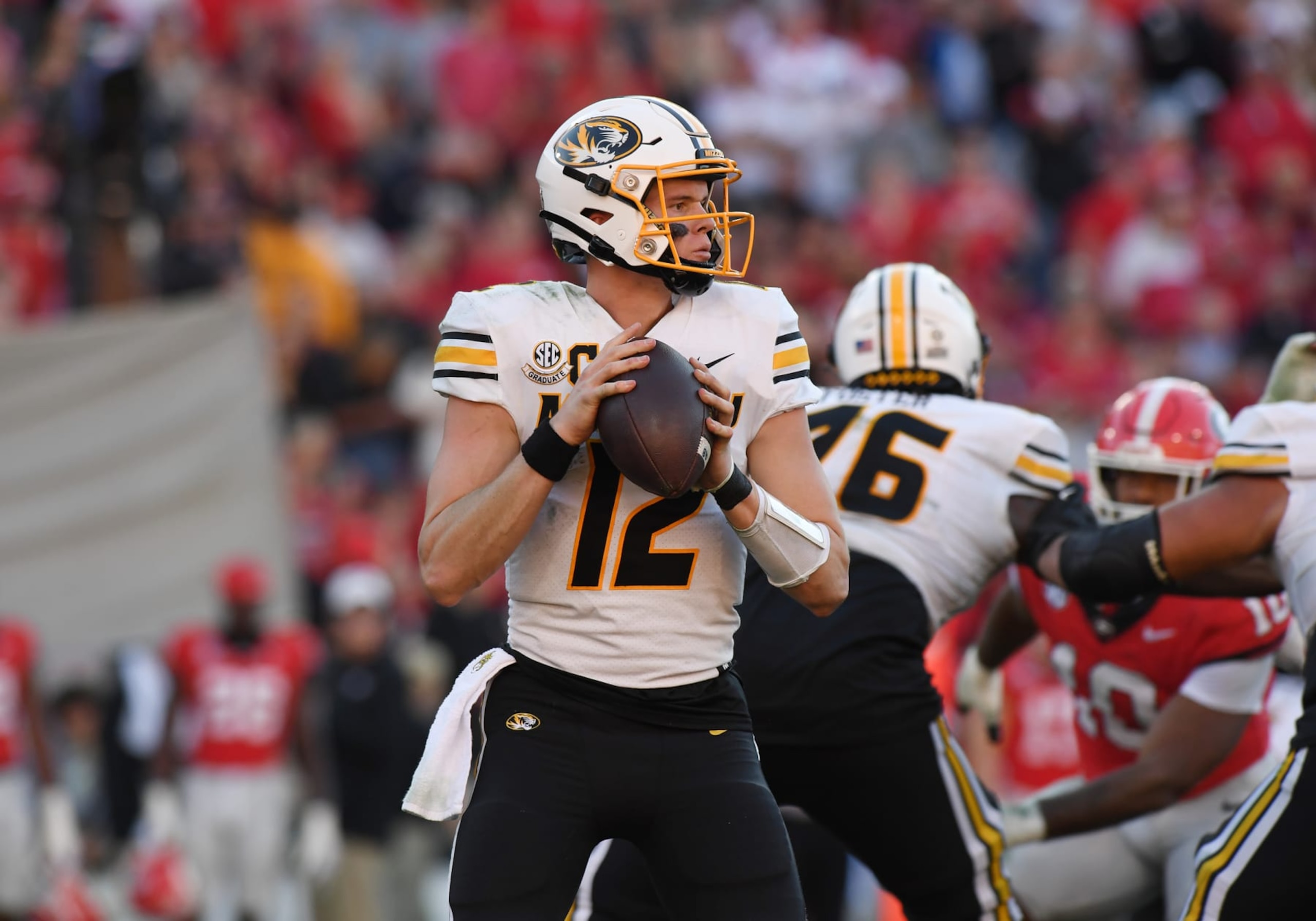 ATHENS, GA - NOVEMBER 04: Missouri Tigers Quarterback Brady Cook (12) looks down field during the college football game between the Missouri Tigers and the Georgia Bulldogs on November 04, 2023, at Sanford Stadium in Athens, GA. (Photo by Jeffrey Vest/Icon Sportswire via Getty Images)
