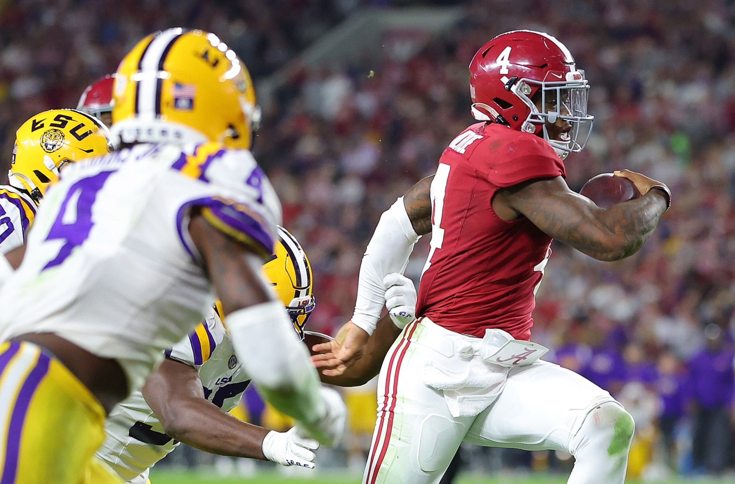 TUSCALOOSA, ALABAMA - NOVEMBER 04:  Jalen Milroe #4 of the Alabama Crimson Tide rushes for a touchdown against the LSU Tigers during the third quarter at Bryant-Denny Stadium on November 04, 2023 in Tuscaloosa, Alabama.  (Photo by Kevin C. Cox/Getty Images)