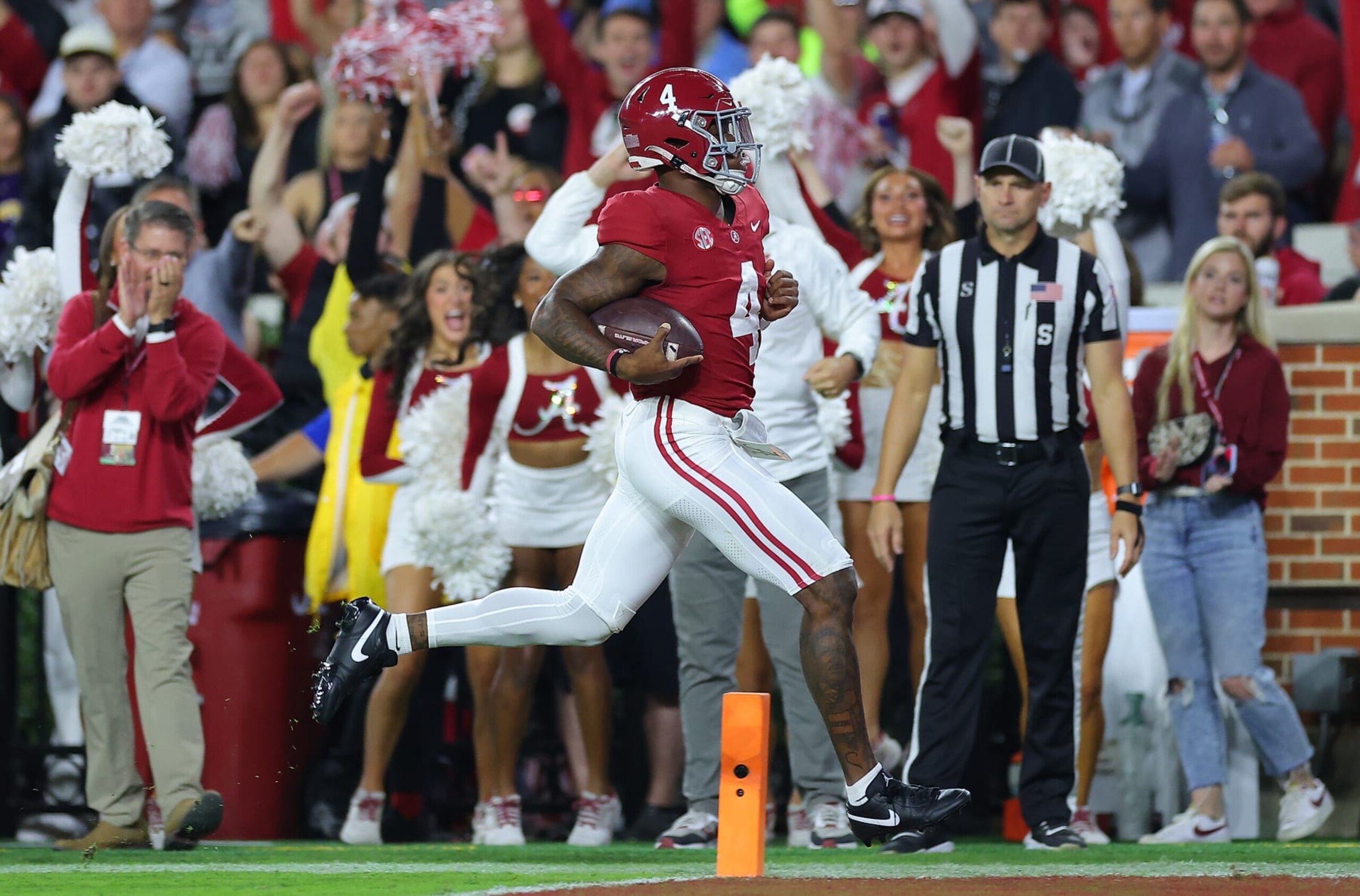TUSCALOOSA, ALABAMA - NOVEMBER 04:  Jalen Milroe #4 of the Alabama Crimson Tide rushes for a touchdown against the LSU Tigers during the first quarter at Bryant-Denny Stadium on November 04, 2023 in Tuscaloosa, Alabama.  (Photo by Kevin C. Cox/Getty Images)