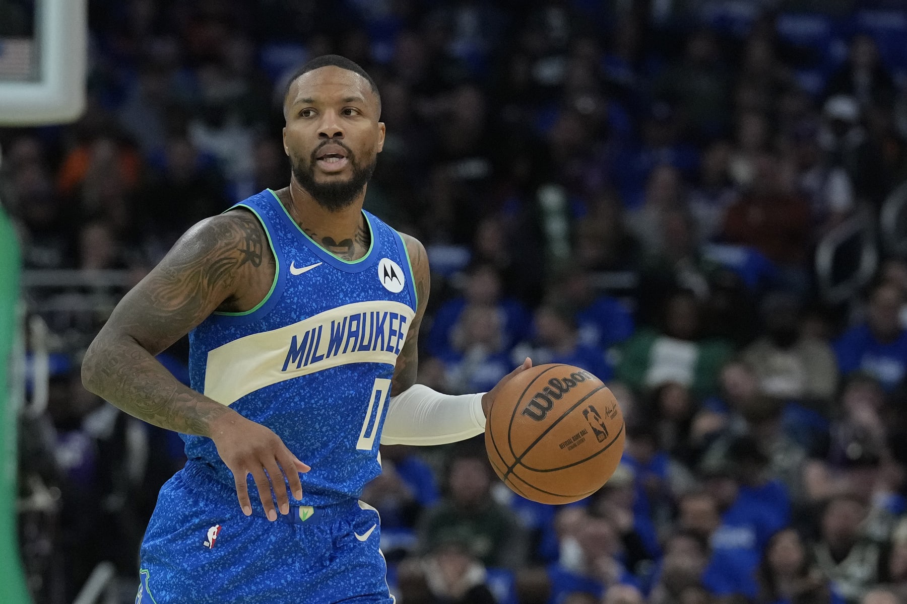 MILWAUKEE, WISCONSIN - NOVEMBER 03: Damian Lillard #0 of the Milwaukee Bucks dribbles the ball against the New York Knicks in the first half during the NBA In-Season Tournament at Fiserv Forum on November 03, 2023 in Milwaukee, Wisconsin. NOTE TO USER: User expressly acknowledges and agrees that, by downloading and or using this photograph, User is consenting to the terms and conditions of the Getty Images License Agreement. (Photo by Patrick McDermott/Getty Images)