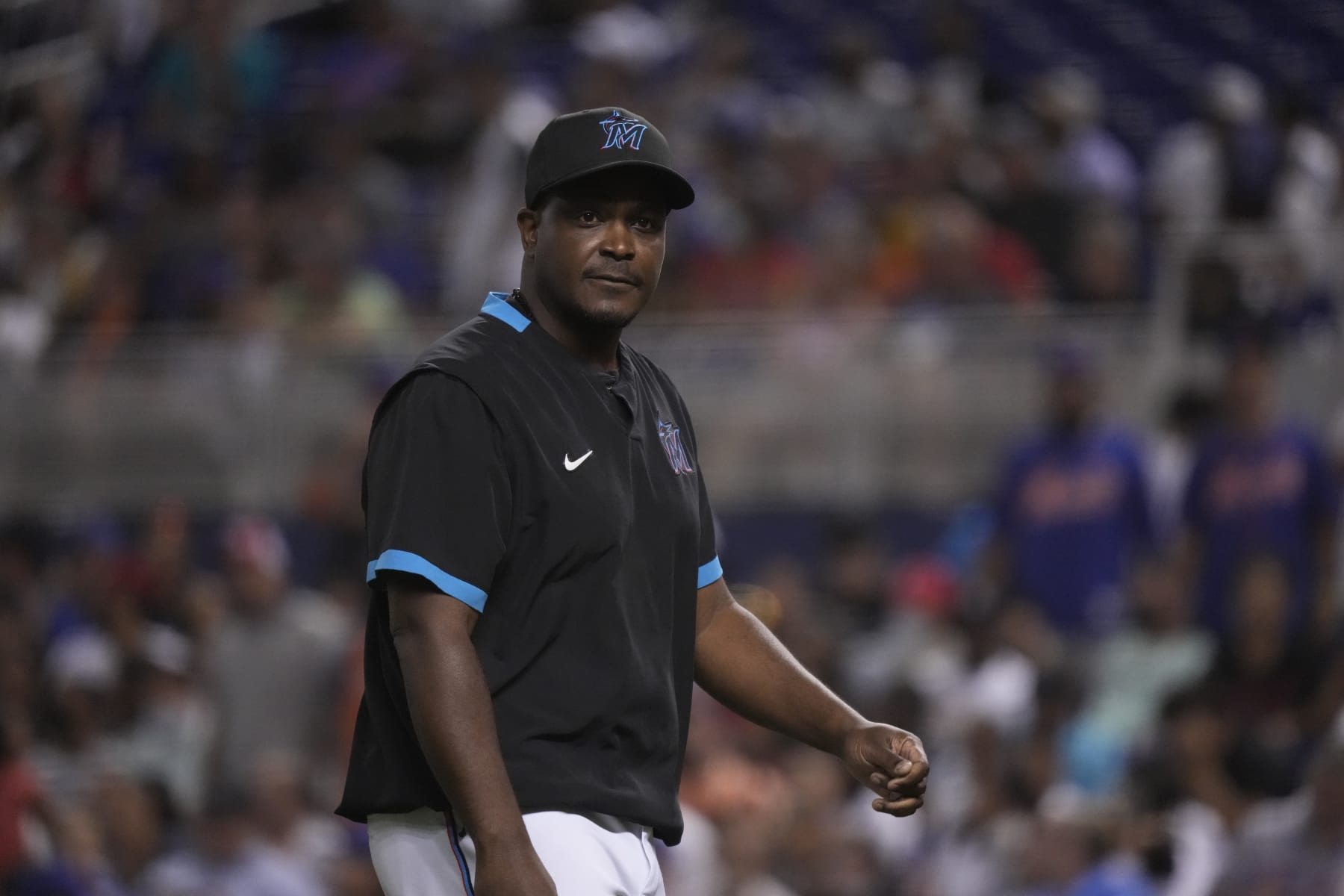 MIAMI, FLORIDA - AUGUST 02: Bench Coach and Acting Manager James Rowson #82 of the Miami Marlins looks on from the dugout during the game against the New York Mets at loanDepot park on August 02, 2021 in Miami, Florida. (Photo by Mark Brown/Getty Images)
