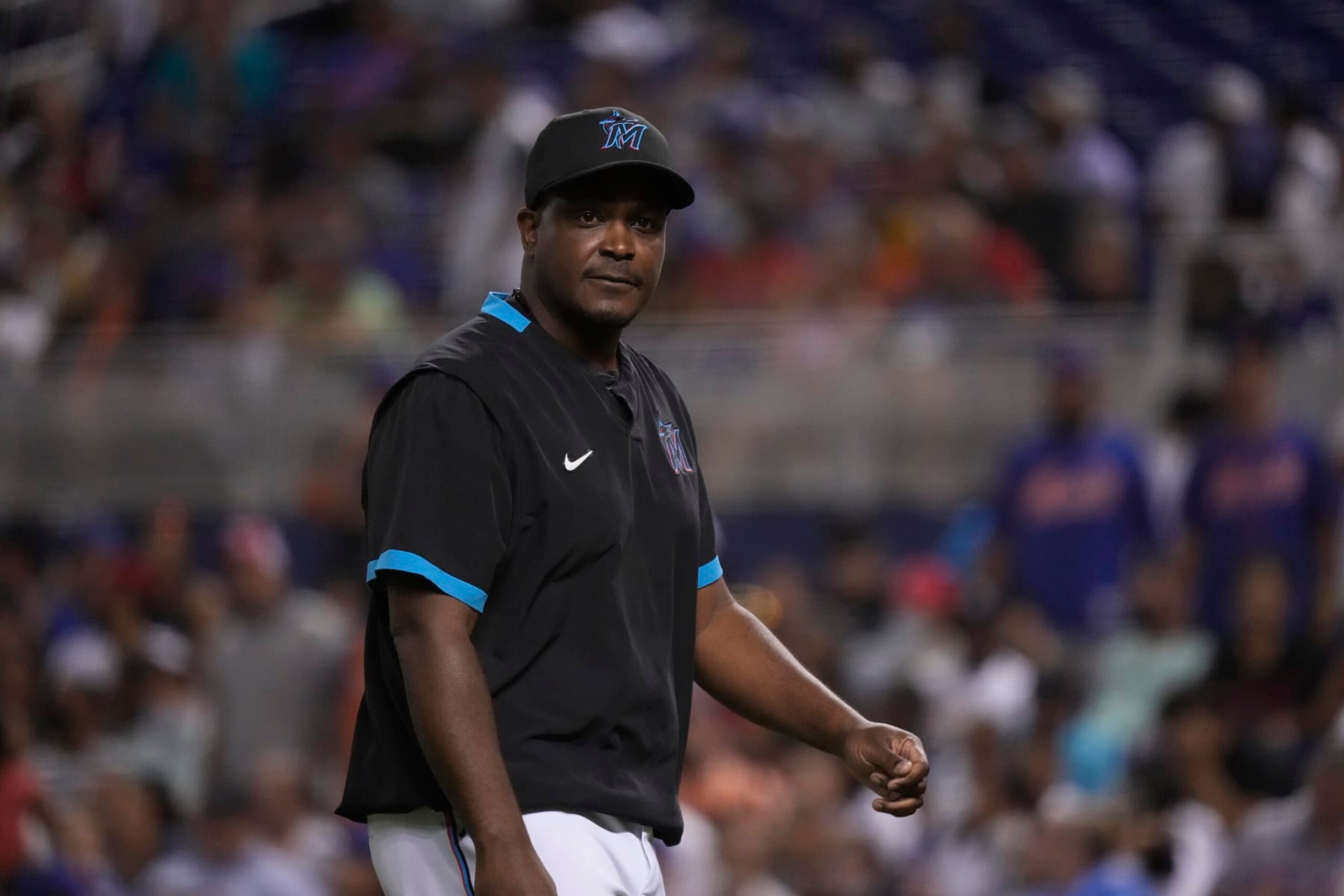 MIAMI, FLORIDA - AUGUST 02: Bench Coach and Acting Manager James Rowson #82 of the Miami Marlins looks on from the dugout during the game against the New York Mets at loanDepot park on August 02, 2021 in Miami, Florida. (Photo by Mark Brown/Getty Images)
