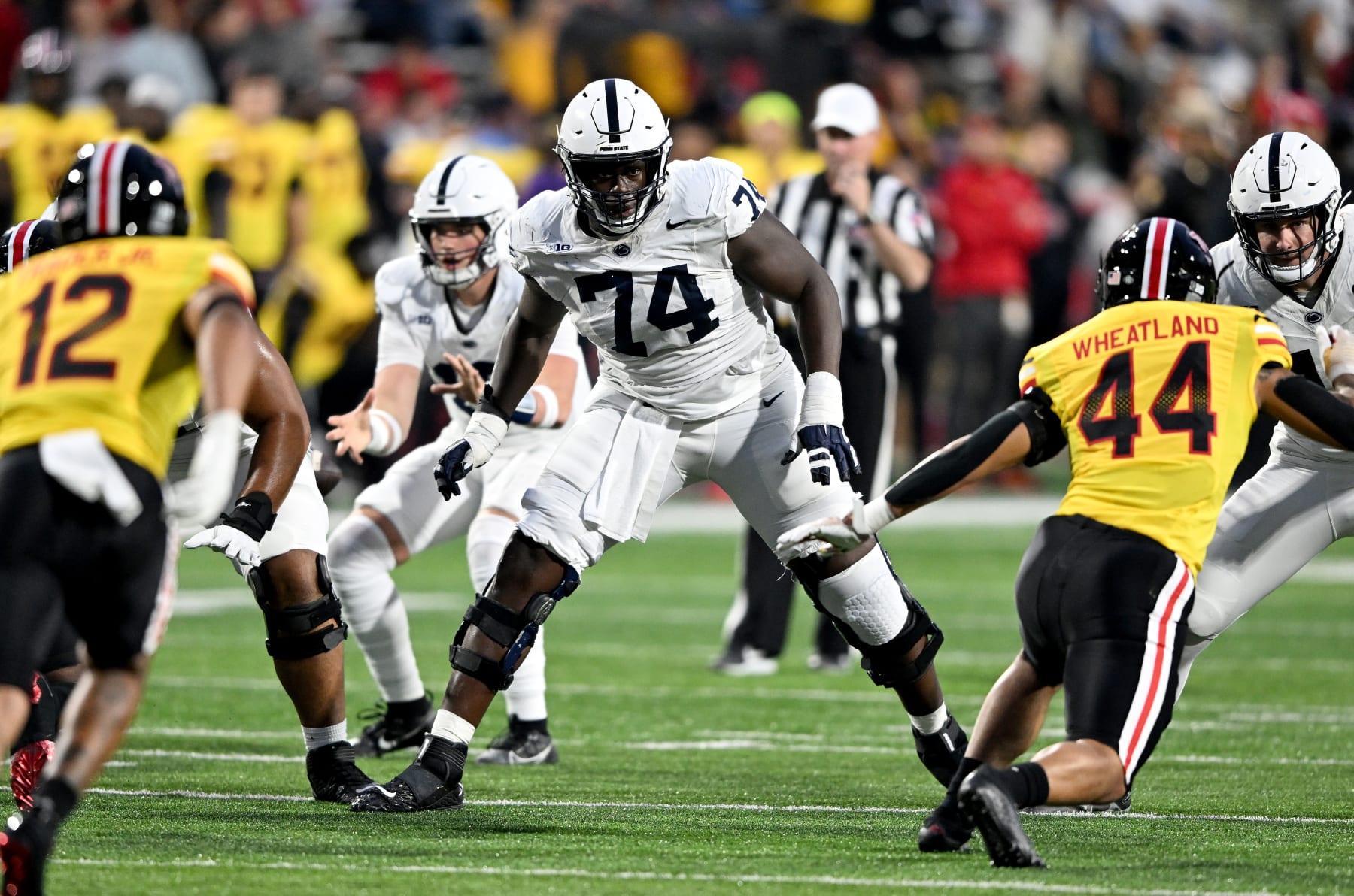 COLLEGE PARK, MARYLAND - NOVEMBER 04: Olumuyiwa Fashanu #74 of the Penn State Nittany Lions blocks against the Maryland Terrapins at SECU Stadium on November 04, 2023 in College Park, Maryland. (Photo by G Fiume/Getty Images)