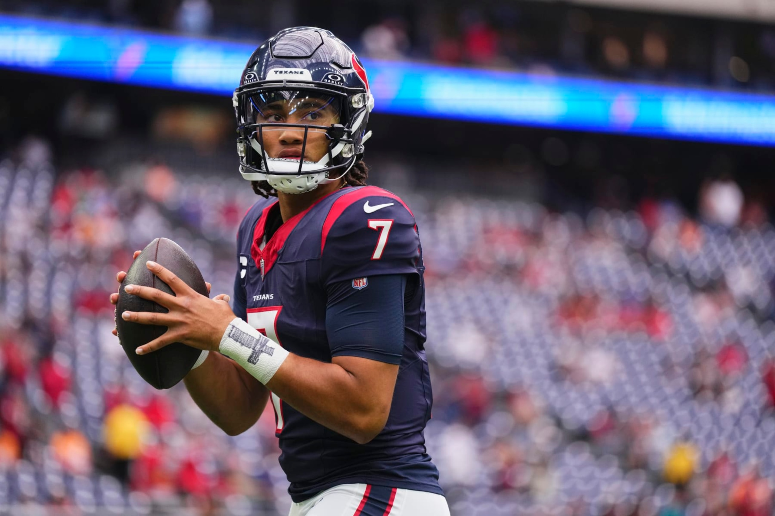 HOUSTON, TX - NOVEMBER 05: C.J. Stroud #7 of the Houston Texans warms up before kickoff against the Tampa Bay Buccaneers at NRG Stadium on November 5, 2023 in Houston, Texas. (Photo by Cooper Neill/Getty Images)