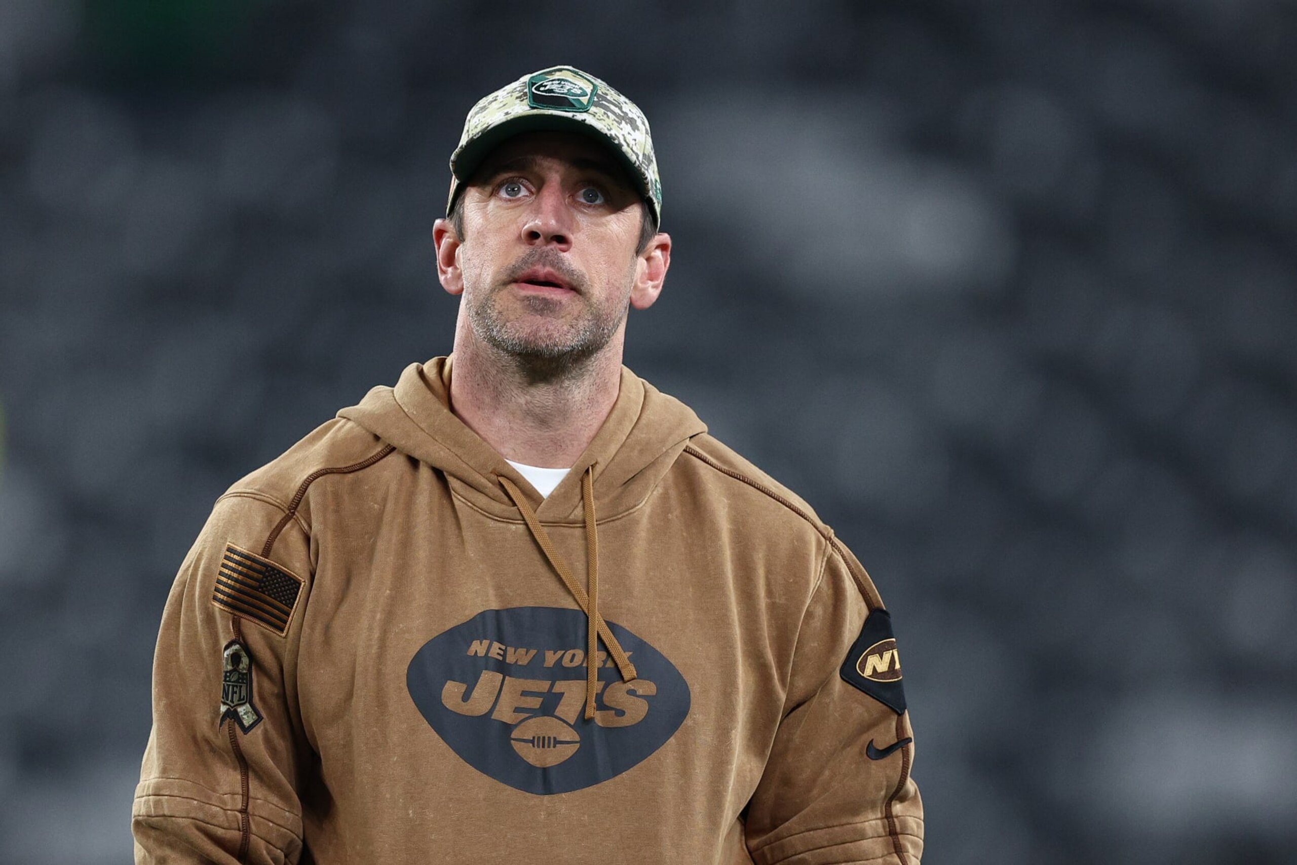 EAST RUTHERFORD, NEW JERSEY - NOVEMBER 06:  Aaron Rodgers #8 of the New York Jets looks on before the game against the Los Angeles Chargers at MetLife Stadium on November 06, 2023 in East Rutherford, New Jersey. (Photo by Elsa/Getty Images)
