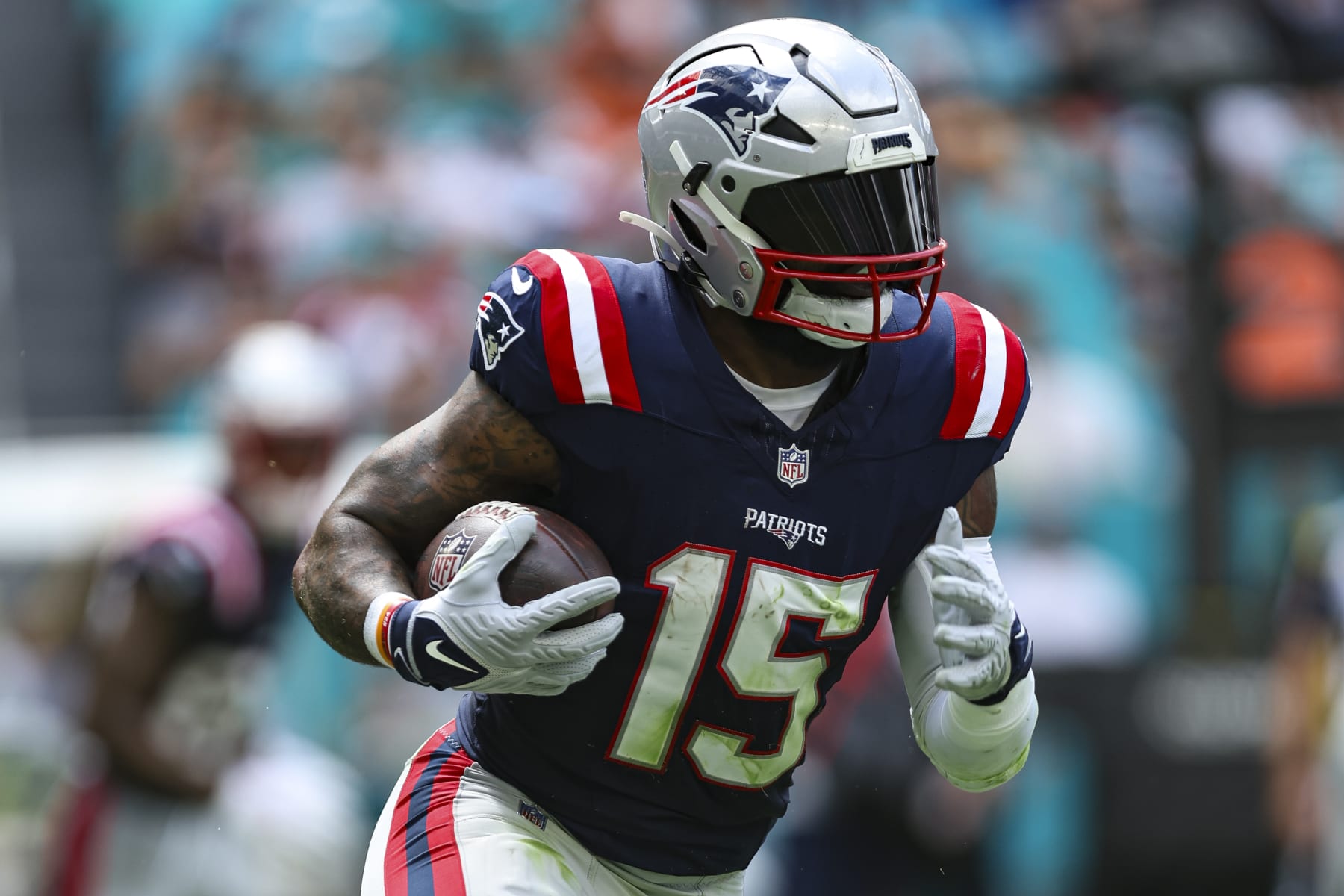 MIAMI GARDENS, FL - OCTOBER 29: Ezekiel Elliott #15 of the New England Patriots runs the ball during an NFL football game against the Miami Dolphins at Hard Rock Stadium on October 29, 2023 in Miami Gardens, Florida. (Photo by Perry Knotts/Getty Images)