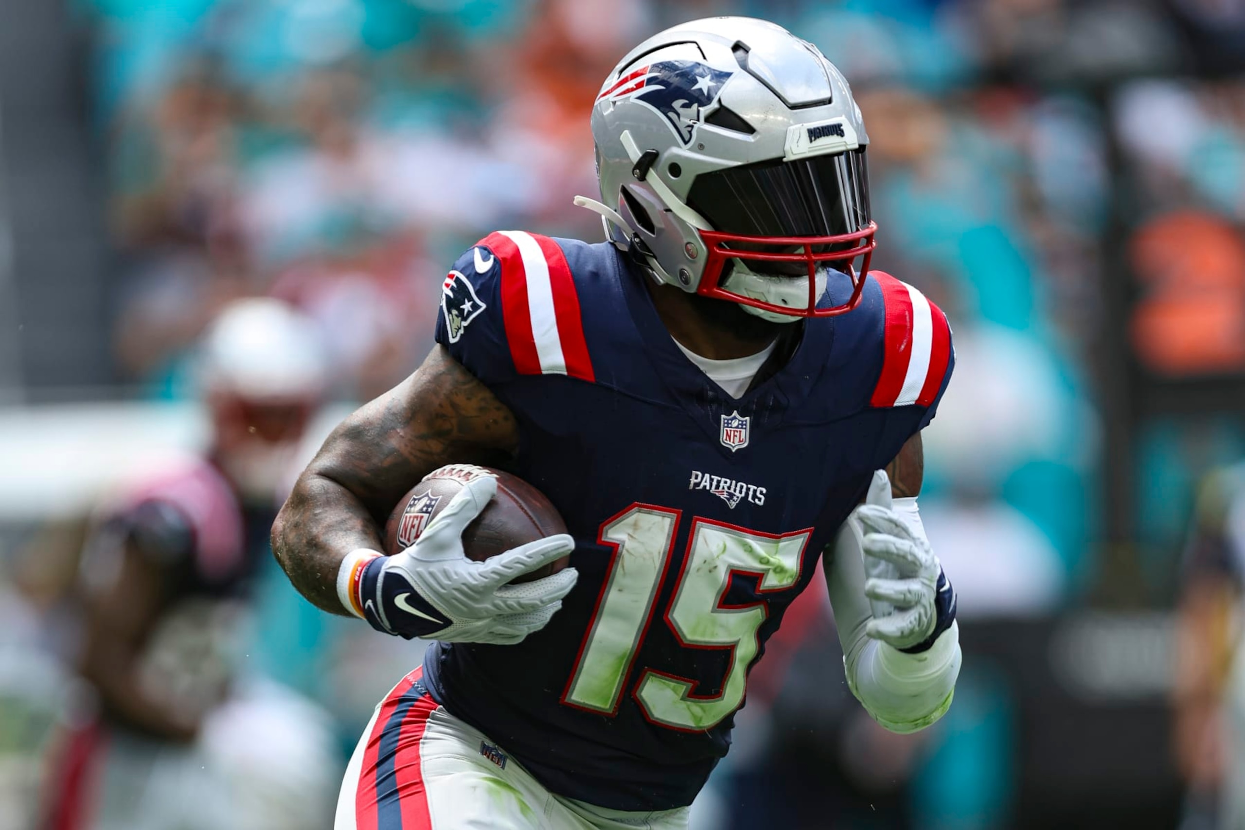 MIAMI GARDENS, FL - OCTOBER 29: Ezekiel Elliott #15 of the New England Patriots runs the ball during an NFL football game against the Miami Dolphins at Hard Rock Stadium on October 29, 2023 in Miami Gardens, Florida. (Photo by Perry Knotts/Getty Images)
