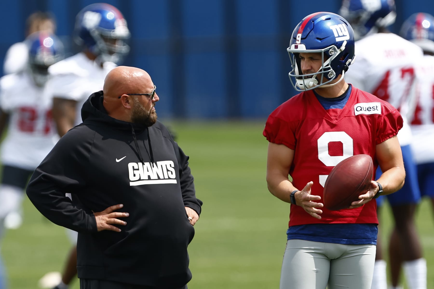 EAST RUTHERFORD, NEW JERSEY - JUNE 14: Head coach Brian Daboll of the New York Giants talks with quarterback Jacob Eason #9 during the teams mini camp at Quest Training Center on June 14, 2023 in East Rutherford, New Jersey. (Photo by Rich Schultz/Getty Images)